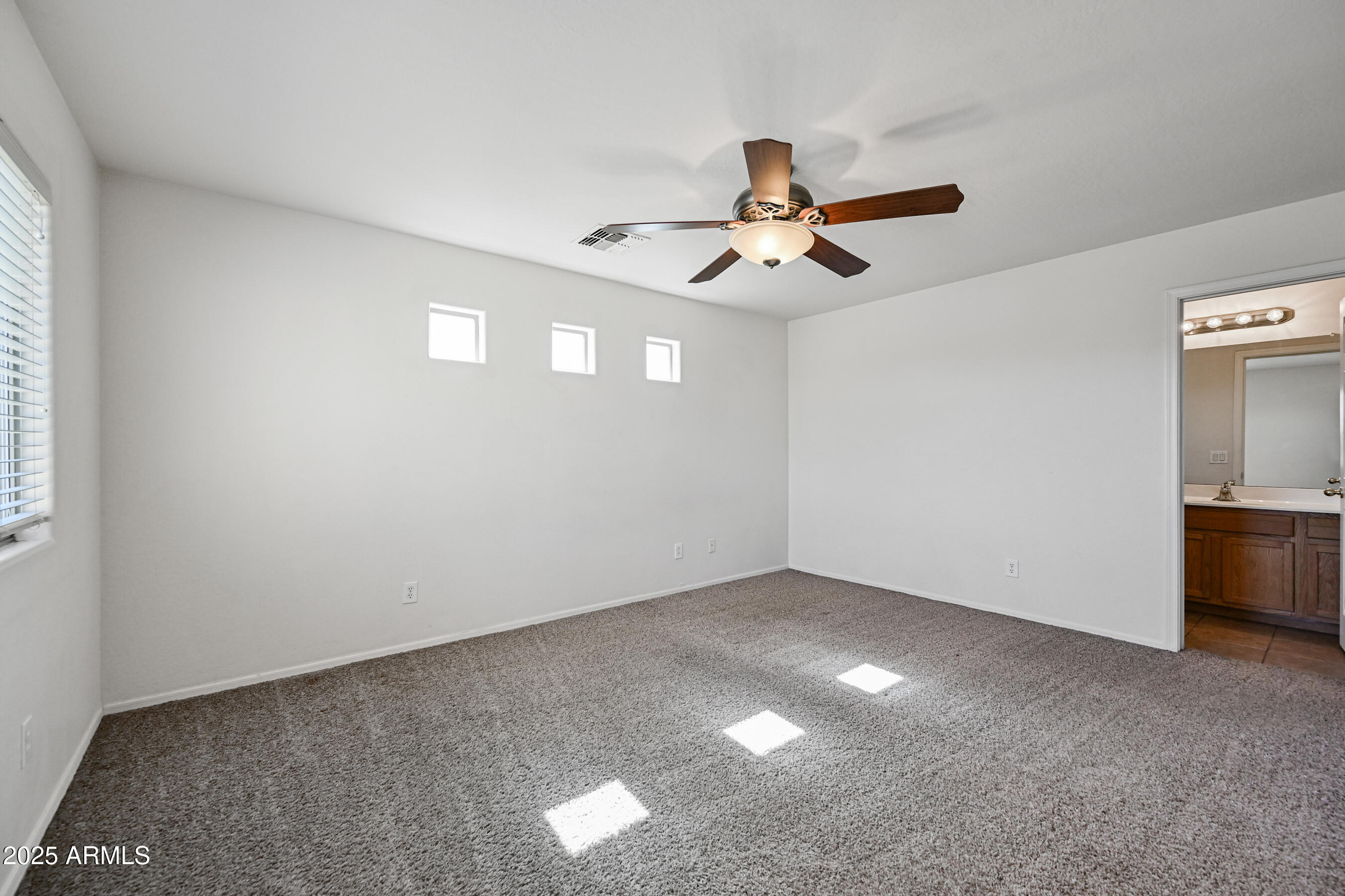 3726 West Pollack Street Phoenix, AZ 85041 - Photo 16 of 27 a view of a big room with carpet