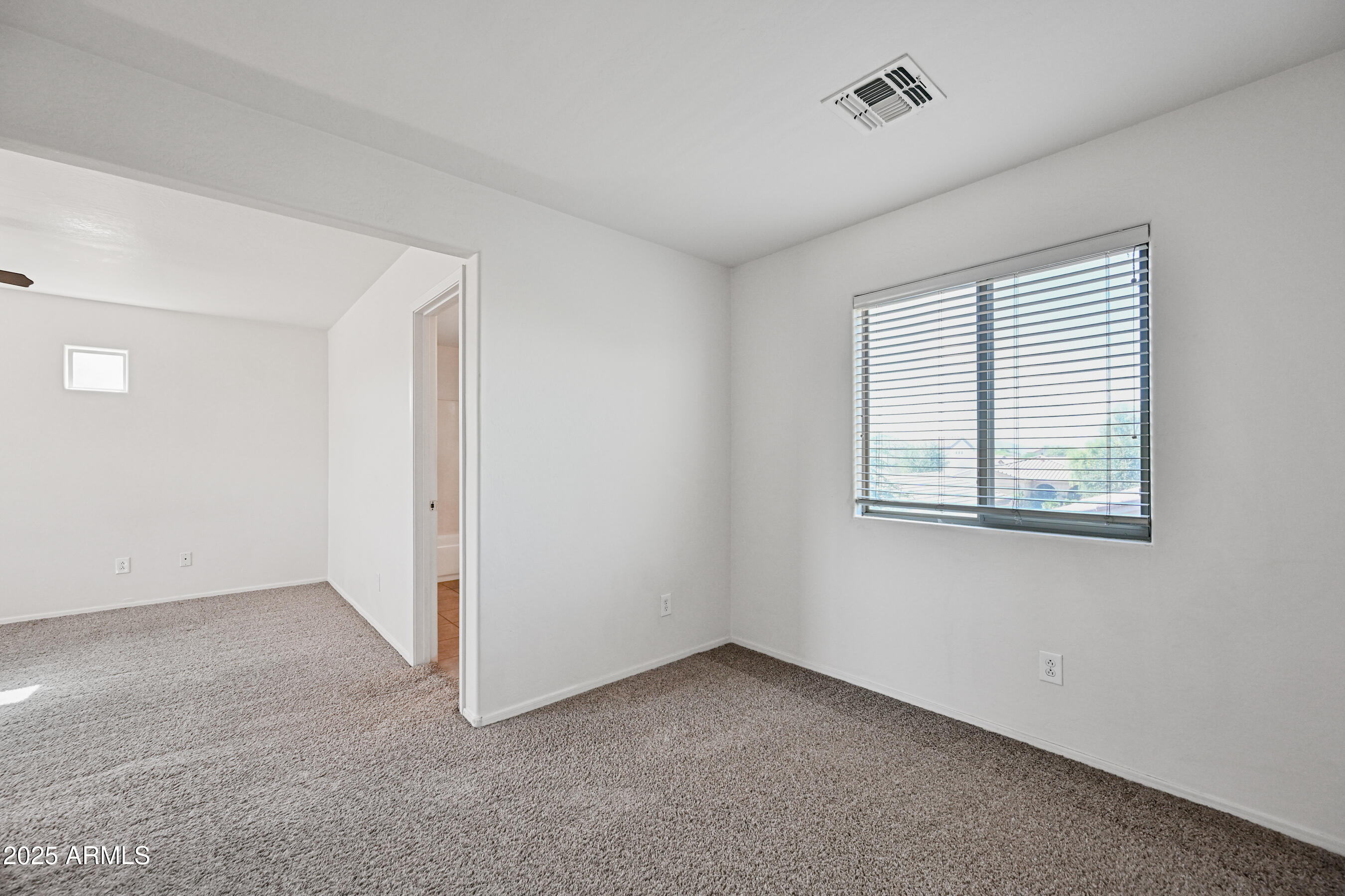 3726 West Pollack Street Phoenix, AZ 85041 - Photo 17 of 27 an empty room with windows