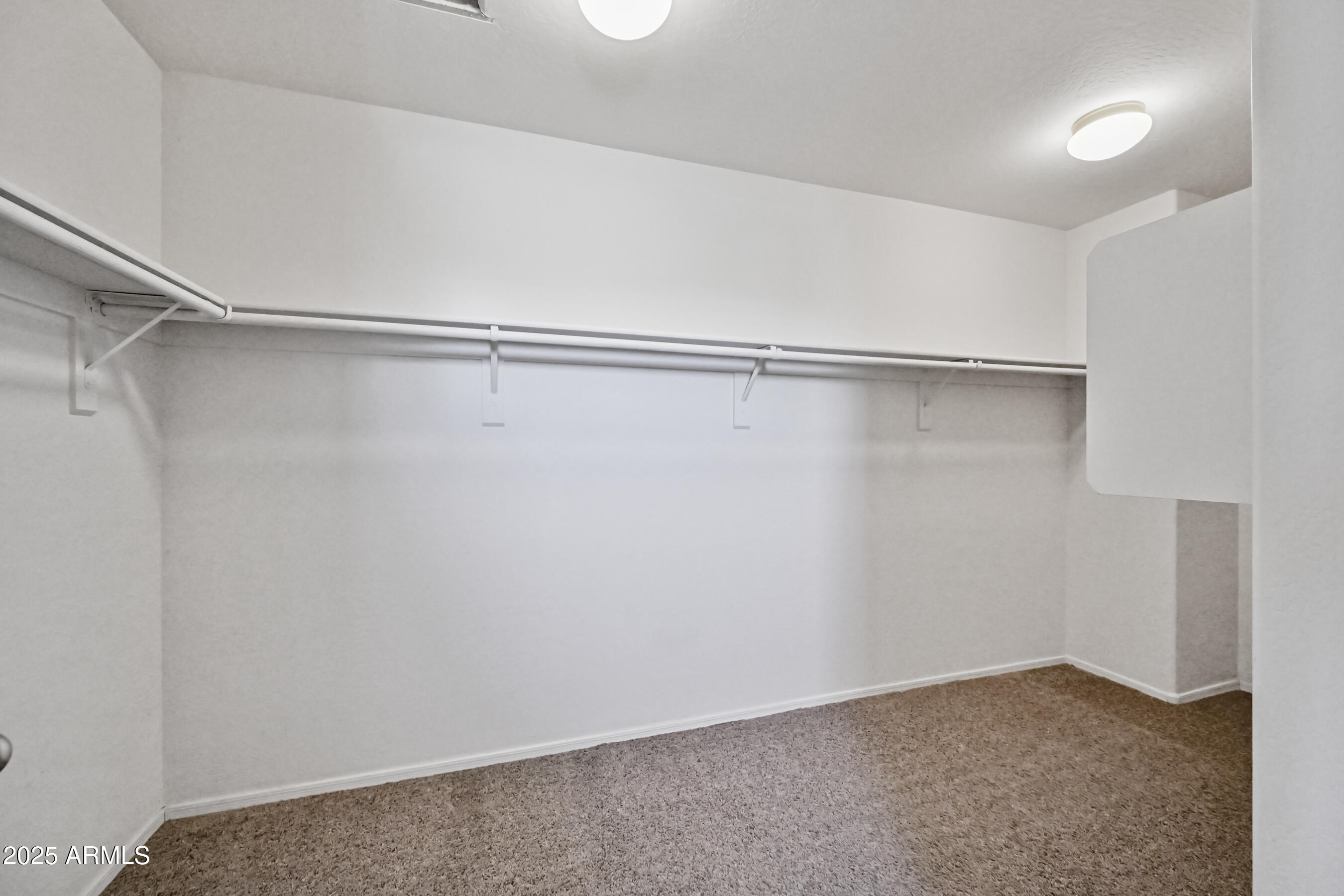 3726 West Pollack Street Phoenix, AZ 85041 - Photo 19 of 27 a view of an empty walk in closet