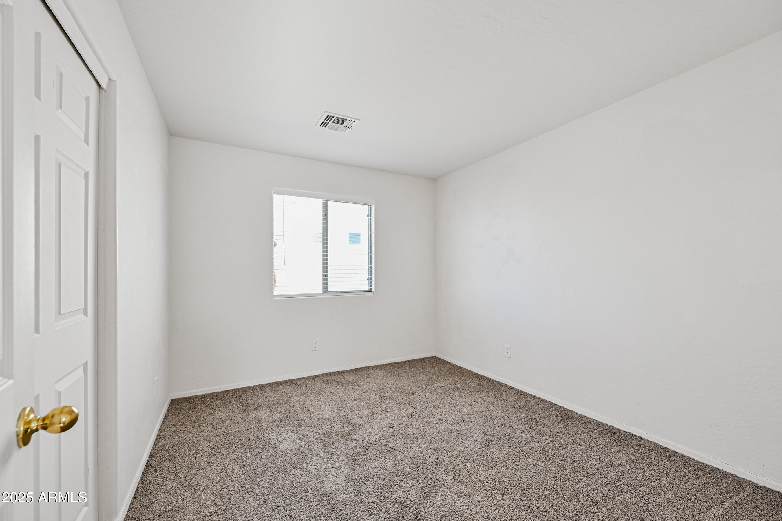 3726 West Pollack Street Phoenix, AZ 85041 - Photo 21 of 27 an empty room with a window