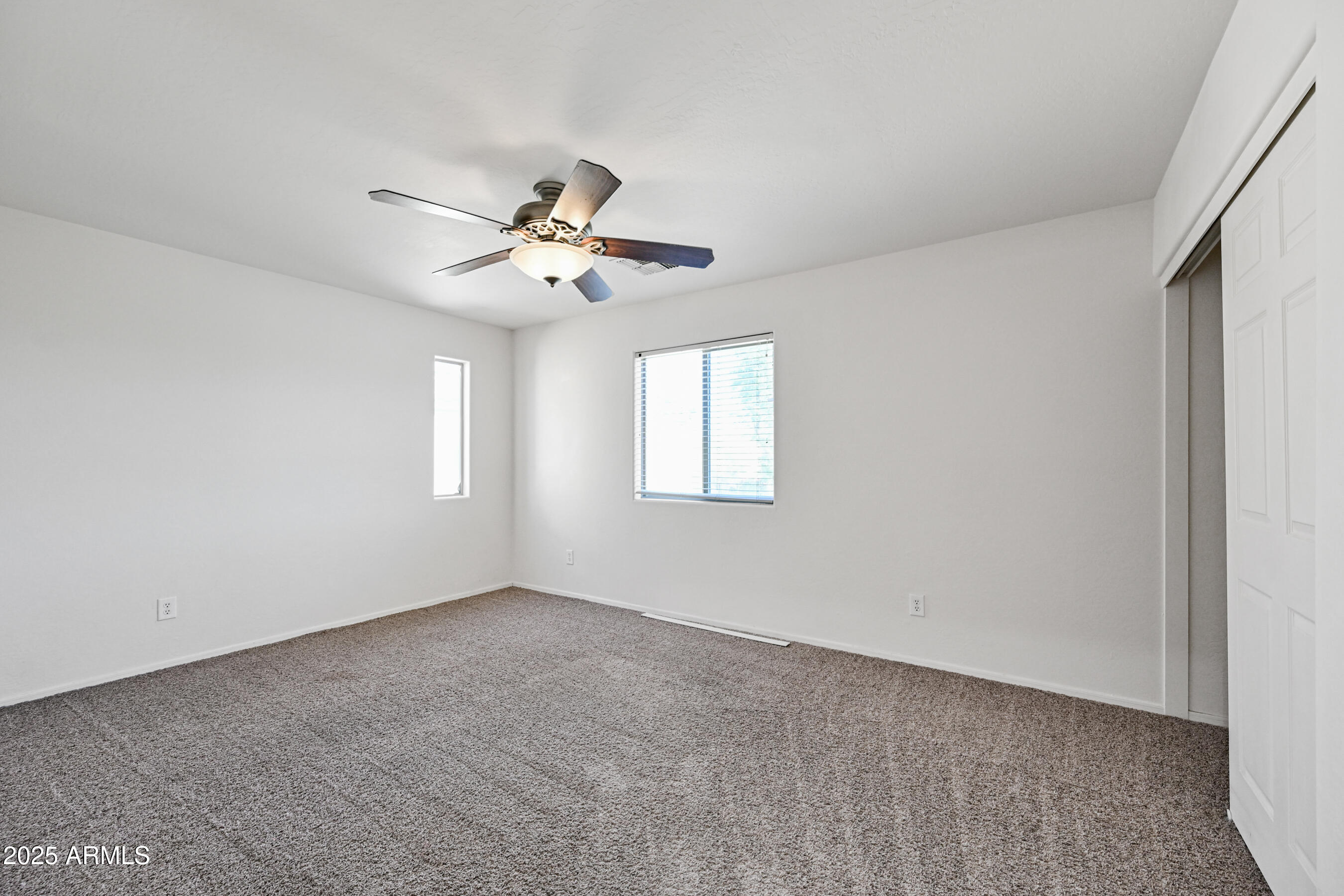3726 West Pollack Street Phoenix, AZ 85041 - Photo 22 of 27 a view of an empty room with a window