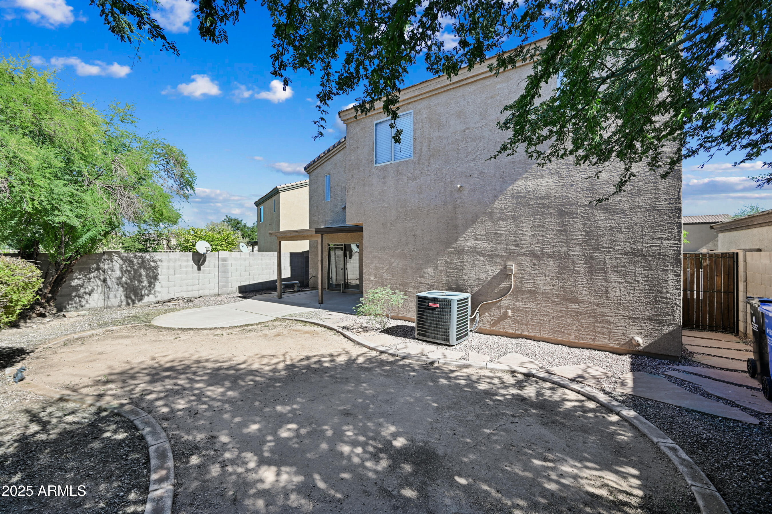 3726 West Pollack Street Phoenix, AZ 85041 - Photo 27 of 27 a front view of a house with a yard and tree s