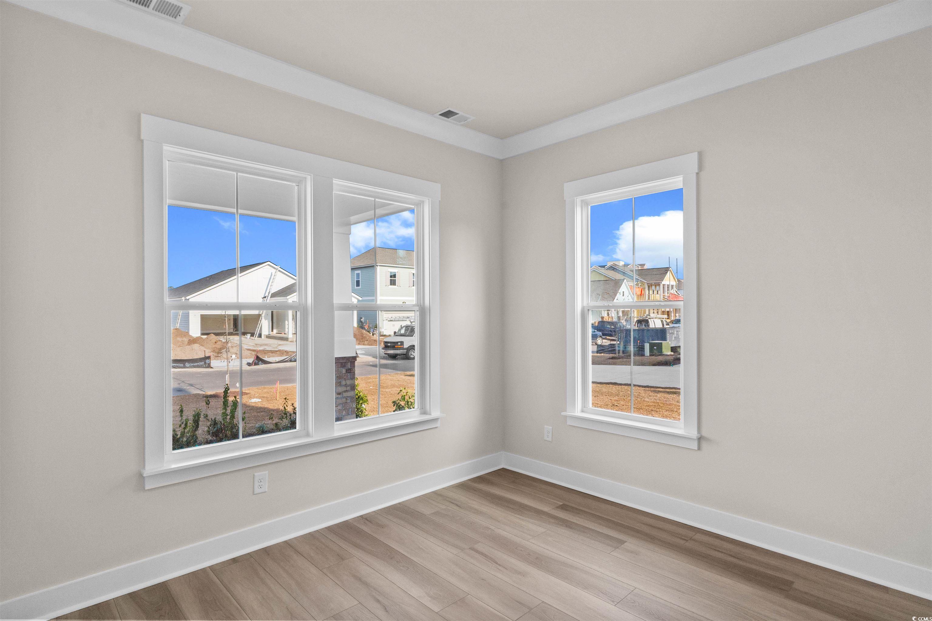 205 Atlantic Breeze Street Myrtle Beach, SC 29572 - Photo 18 of 28 Unfurnished room featuring baseboards and light wood-type flooring