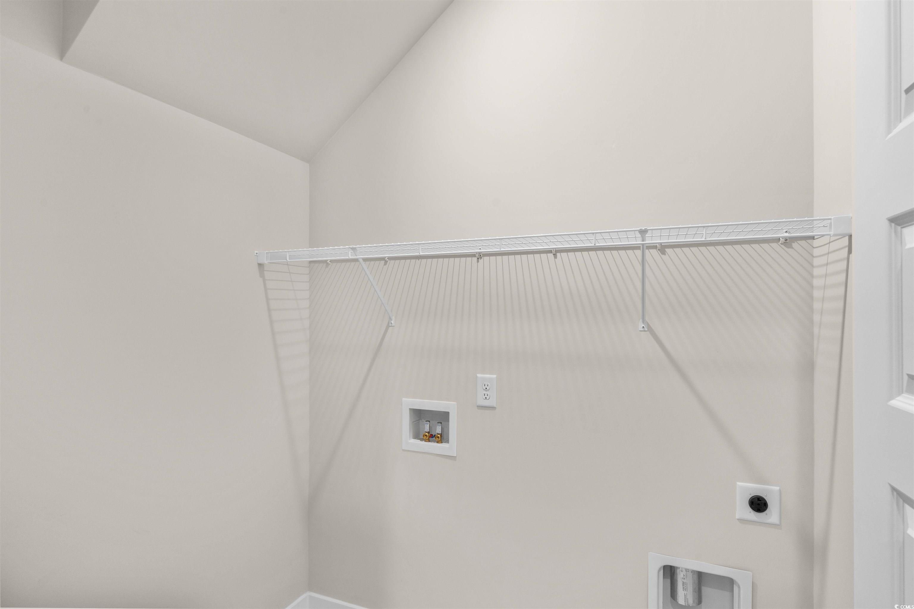 205 Atlantic Breeze Street Myrtle Beach, SC 29572 - Photo 19 of 28 Laundry area with washer hookup, hookup for an electric dryer, and lofted ceiling