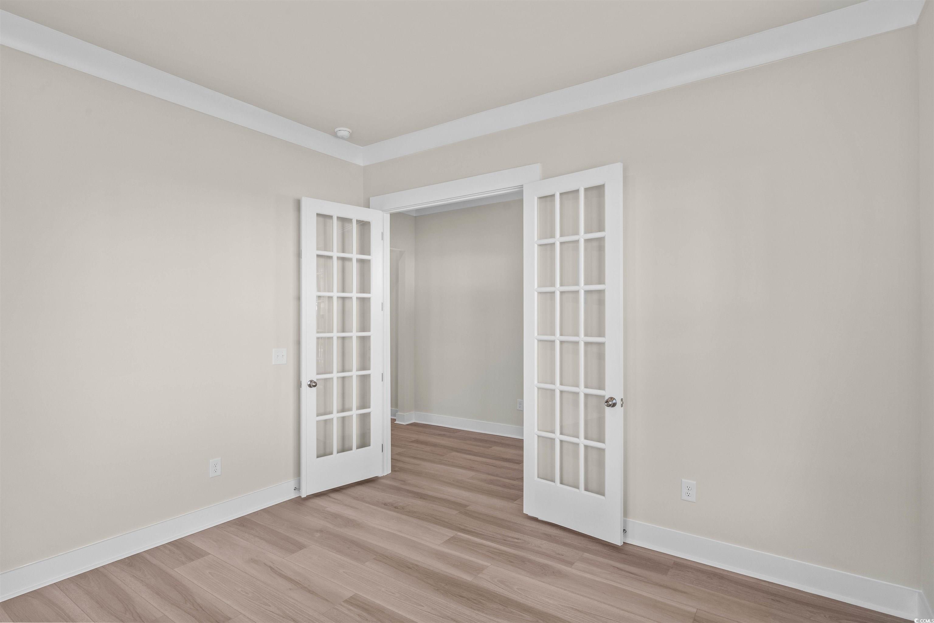 205 Atlantic Breeze Street Myrtle Beach, SC 29572 - Photo 20 of 28 Unfurnished room with french doors and light wood-type flooring