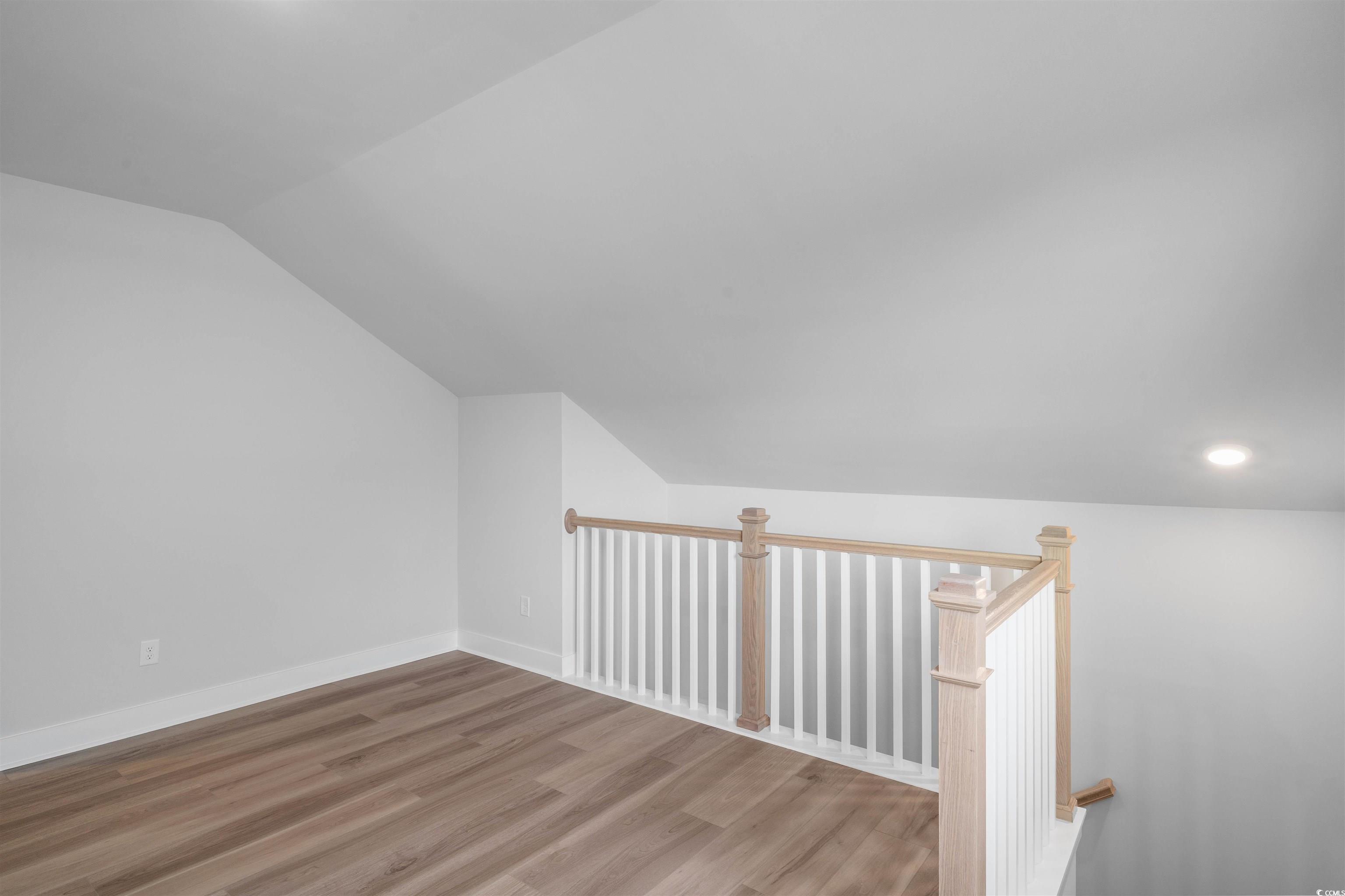 205 Atlantic Breeze Street Myrtle Beach, SC 29572 - Photo 22 of 28 Bonus room with vaulted ceiling and wood finished floors