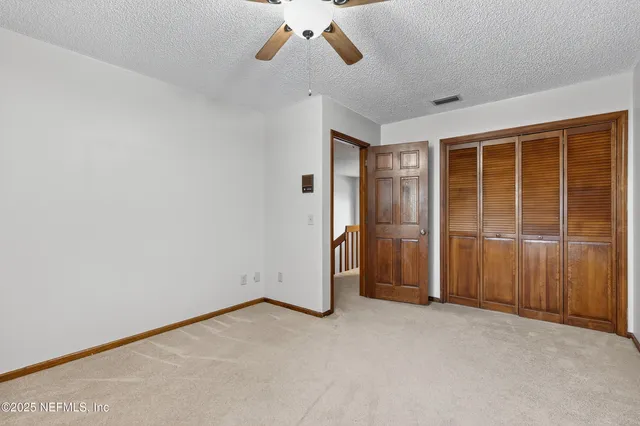 an empty room with a empty space and windows