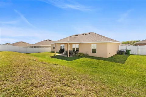 a view of a house with a big yard