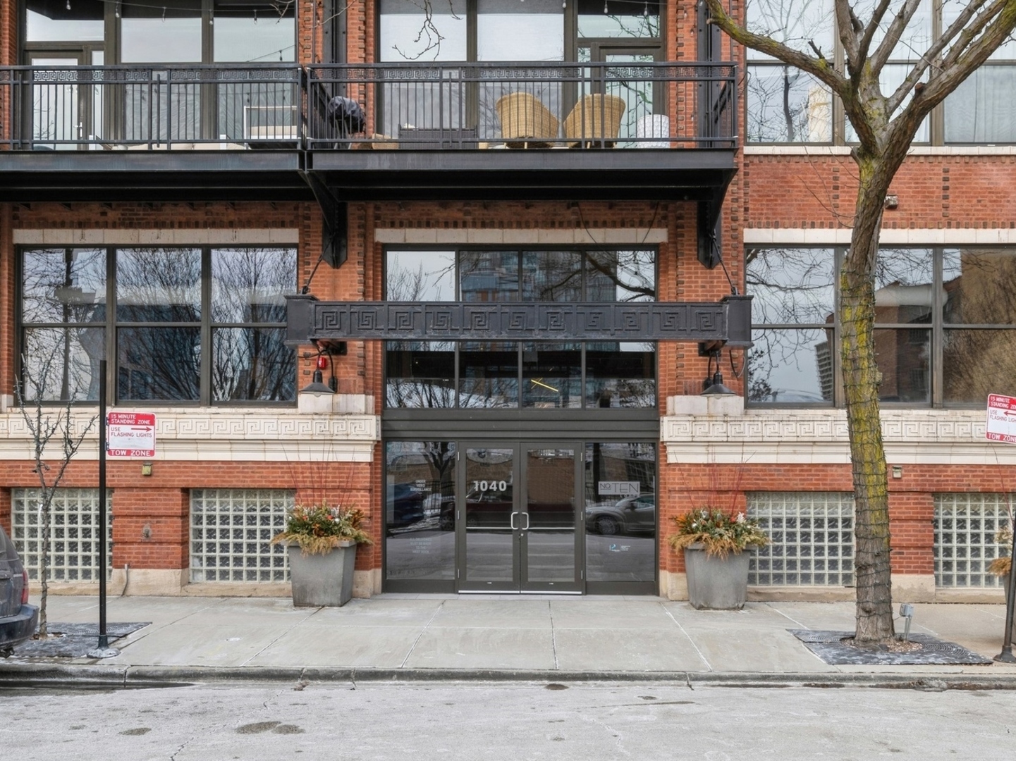 1040 West Adams Street, Unit 442 Chicago, IL 60607 - Photo 1 of 23 a front view of a building with glass windows