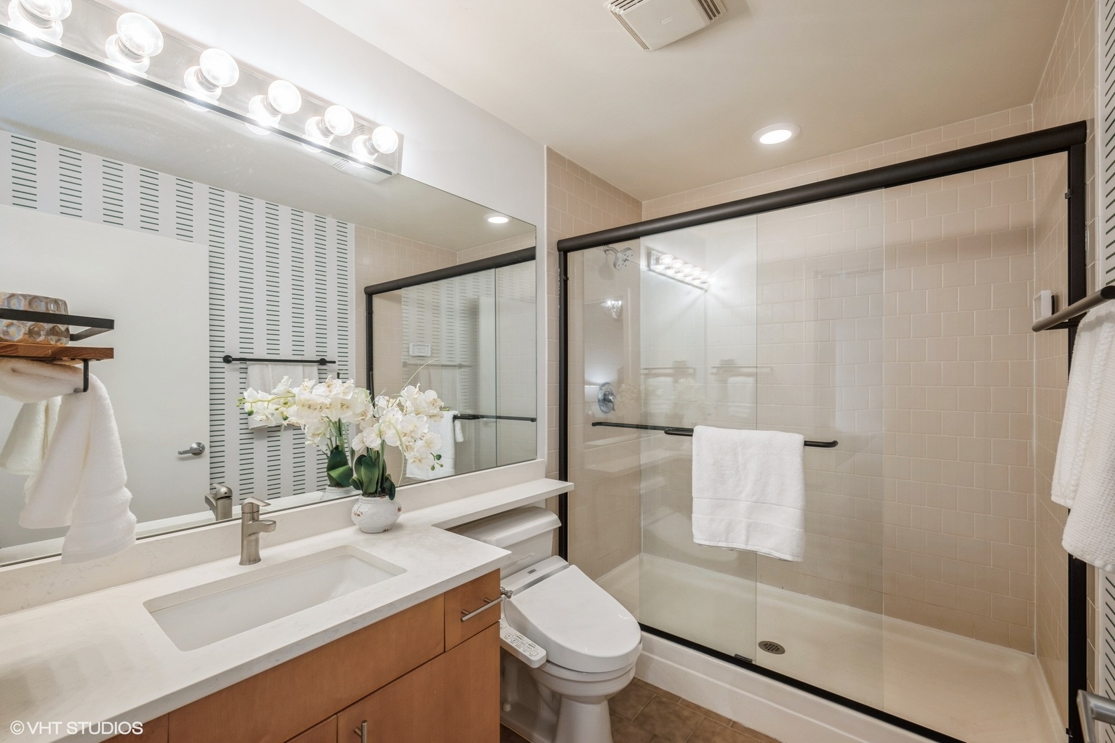 1040 West Adams Street, Unit 442 Chicago, IL 60607 - Photo 15 of 23 a bathroom with a sink toilet and shower