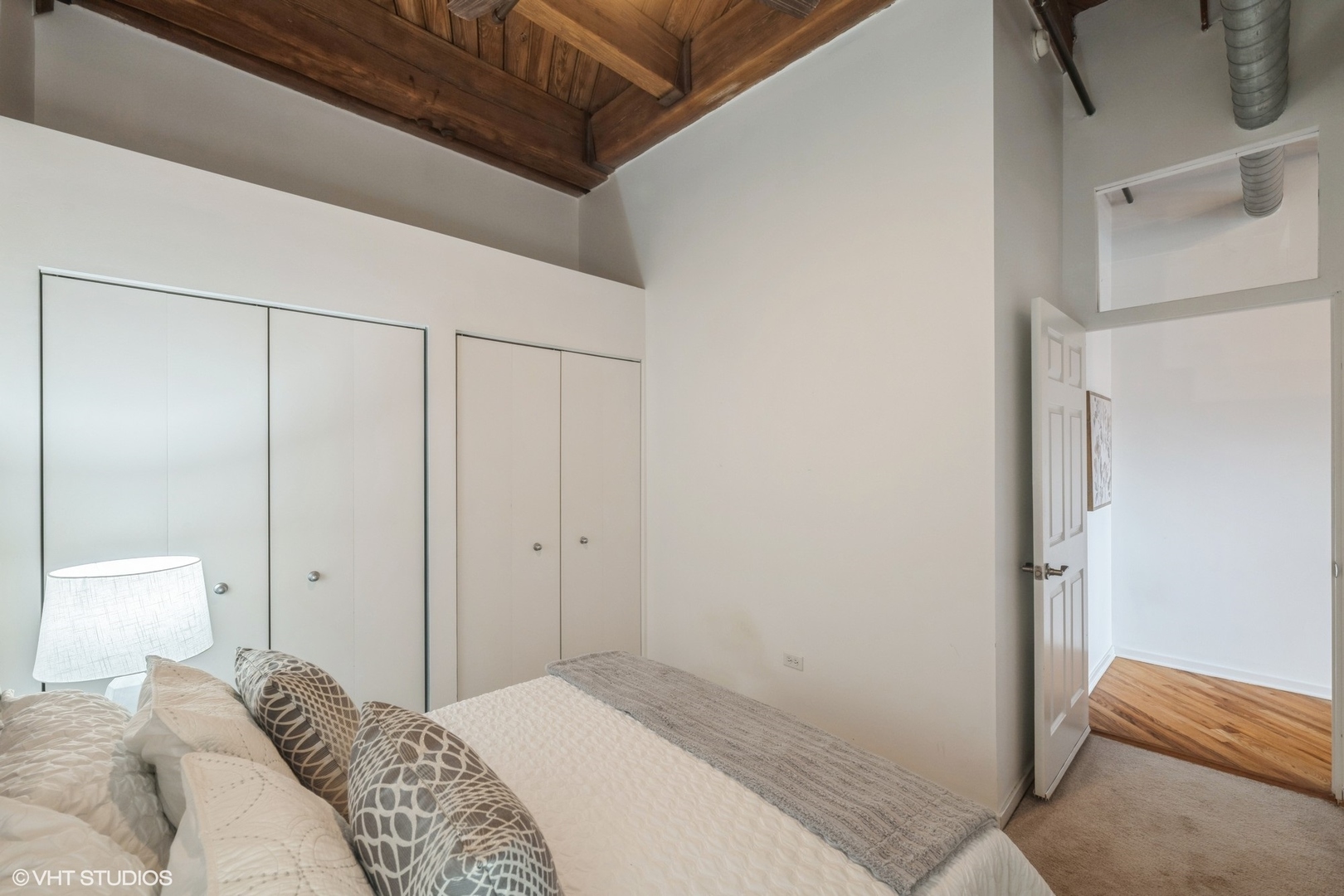 1040 West Adams Street, Unit 442 Chicago, IL 60607 - Photo 19 of 23 a bedroom with a bed and a walk in closet