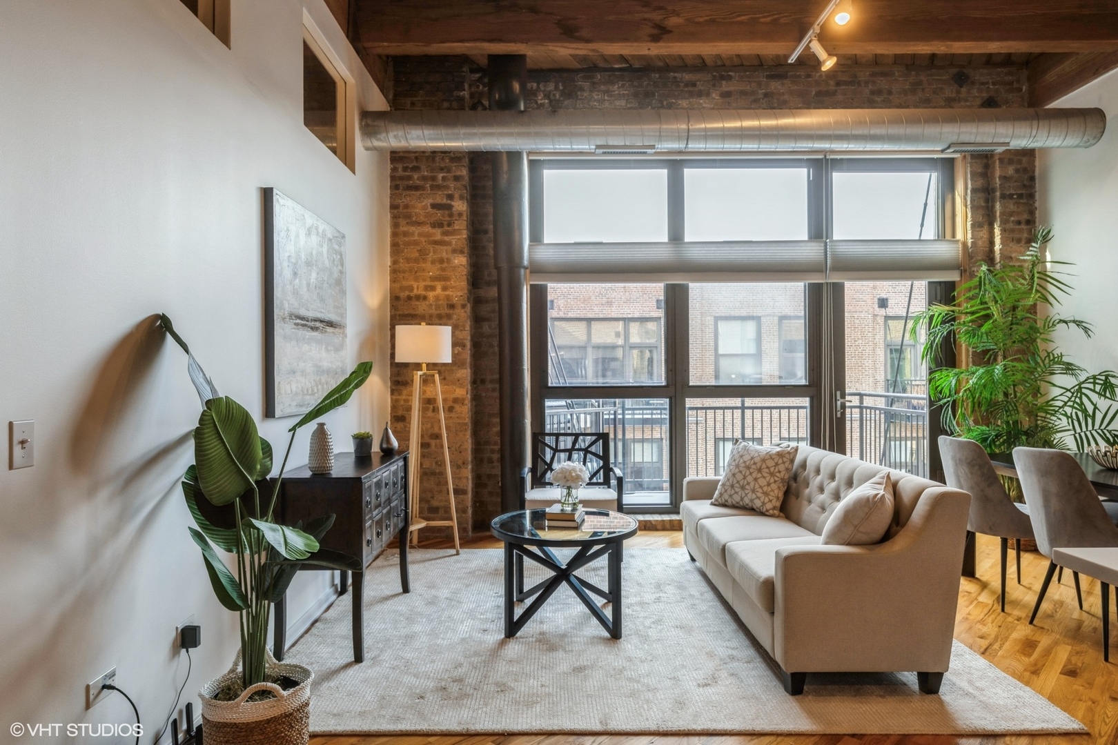 1040 West Adams Street, Unit 442 Chicago, IL 60607 - Photo 3 of 23 a living room with furniture a rug and a large window
