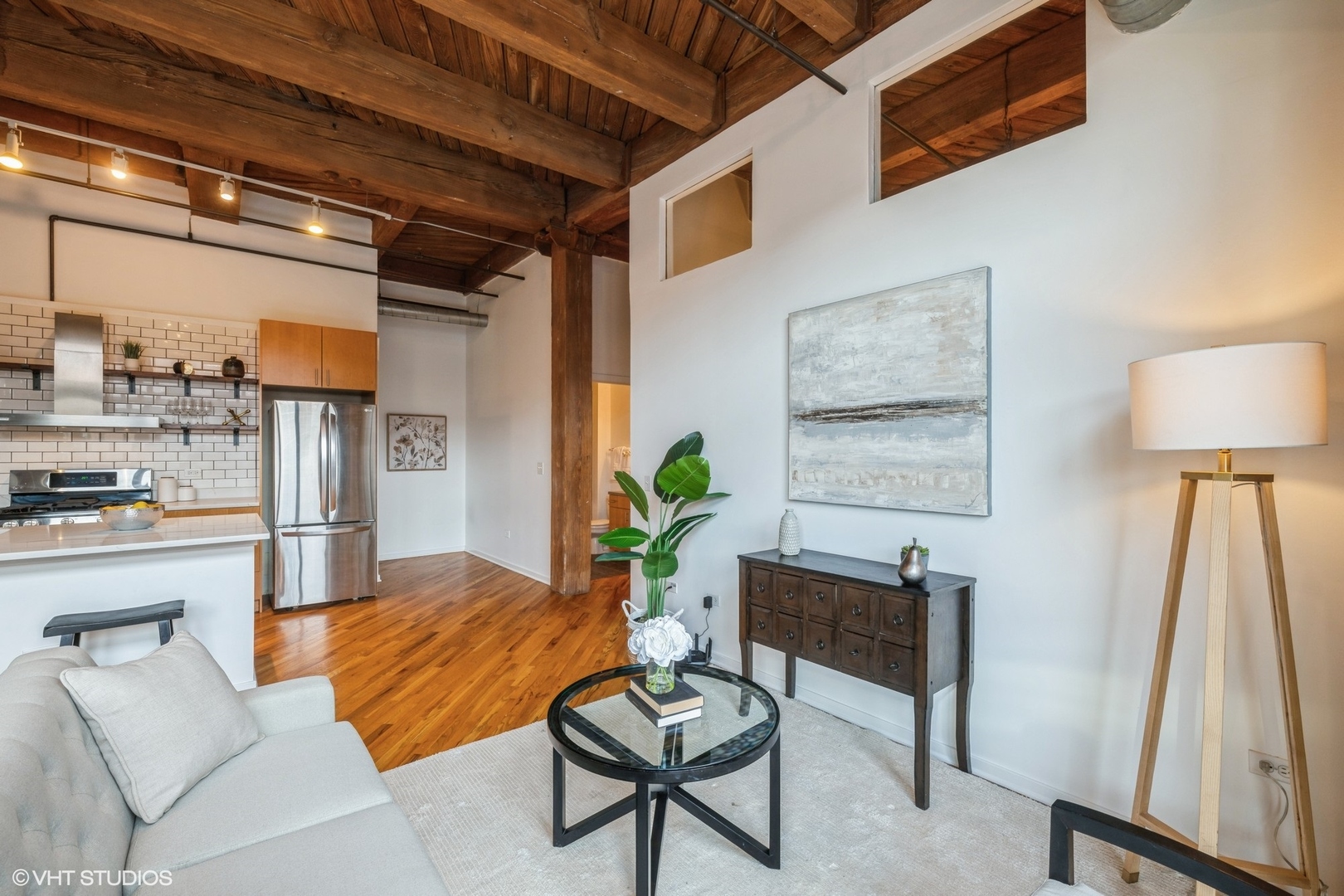1040 West Adams Street, Unit 442 Chicago, IL 60607 - Photo 4 of 23 a living room with furniture and a table