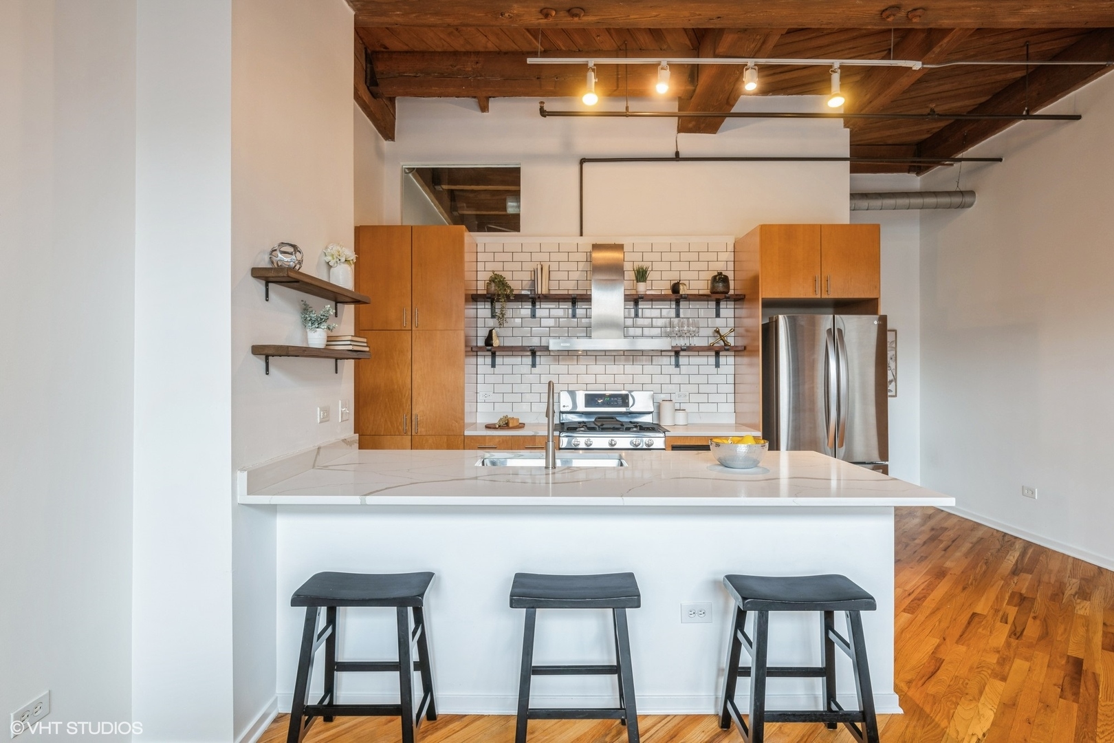 1040 West Adams Street, Unit 442 Chicago, IL 60607 - Photo 7 of 23 a dining table with chairs and wooden floor