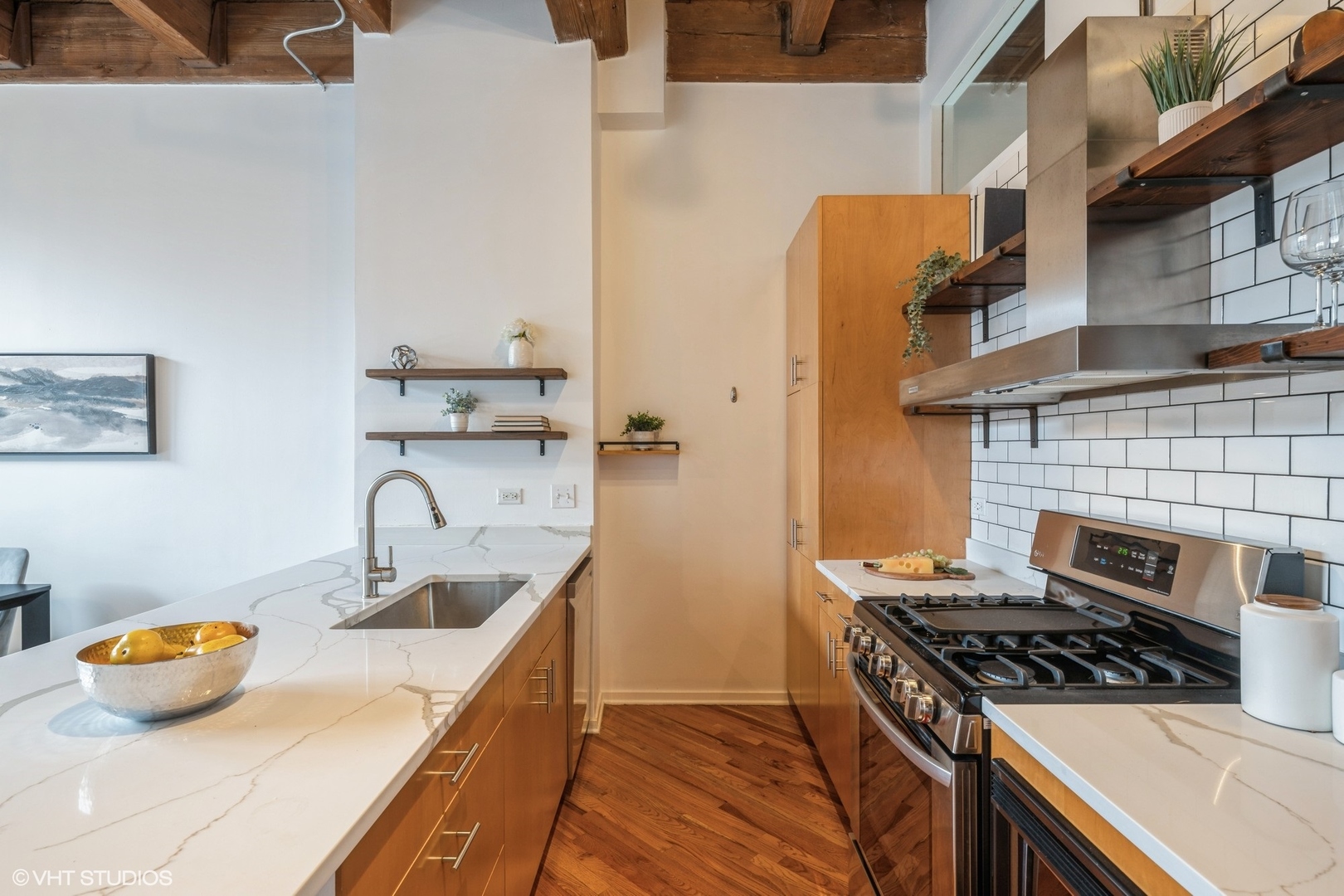 1040 West Adams Street, Unit 442 Chicago, IL 60607 - Photo 9 of 23 a kitchen that has a sink and a stove