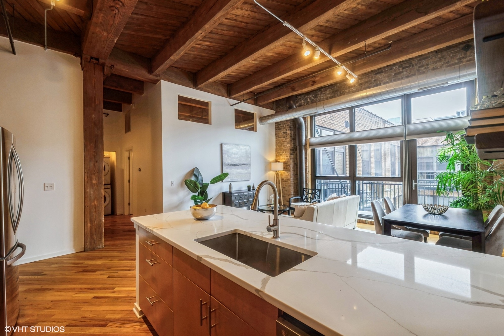 1040 West Adams Street, Unit 442 Chicago, IL 60607 - Photo 10 of 23 a kitchen with sink and large window