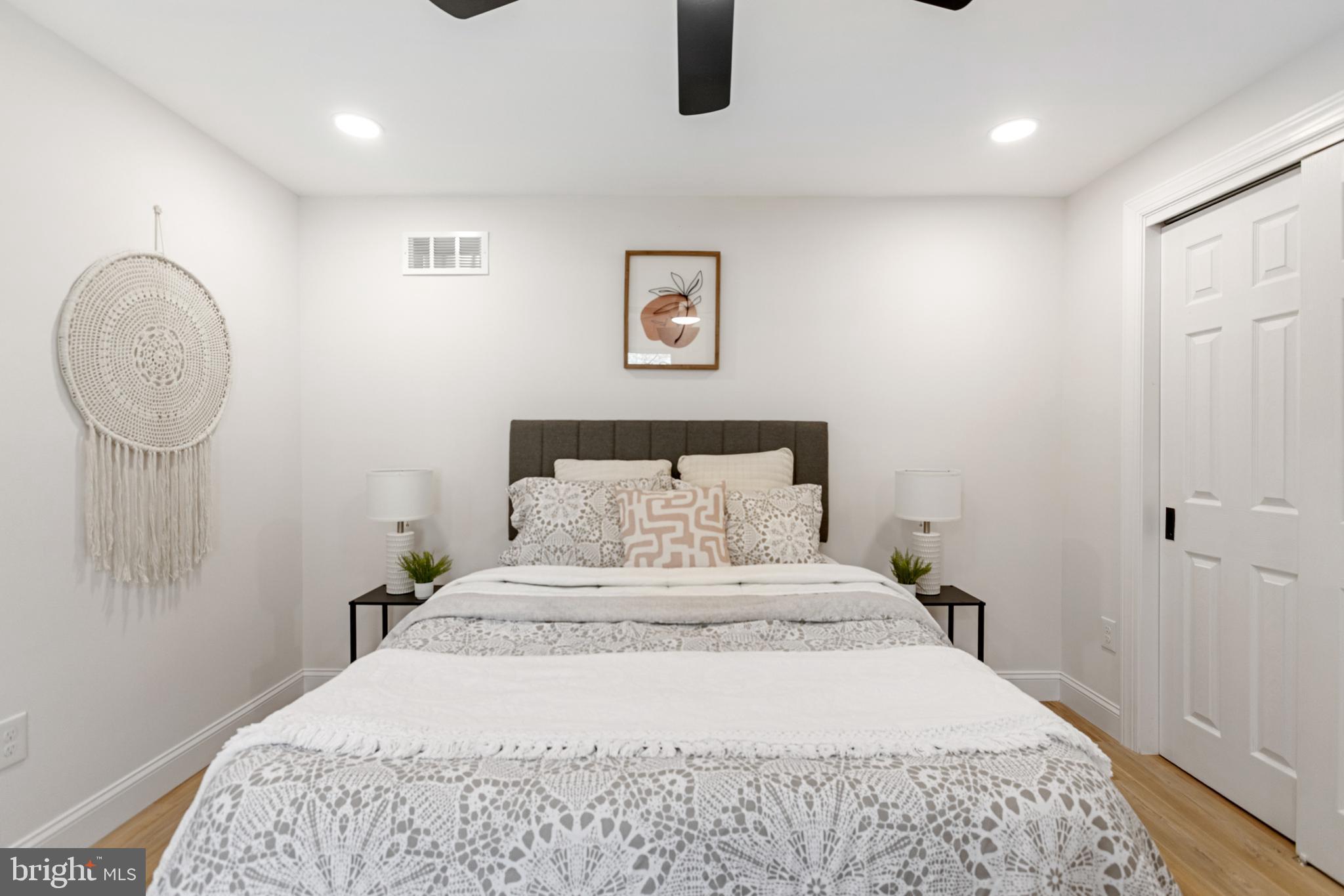 766 Highland Road Deptford, NJ 08096 - Photo 13 of 41 a bedroom with a bed and a lamp