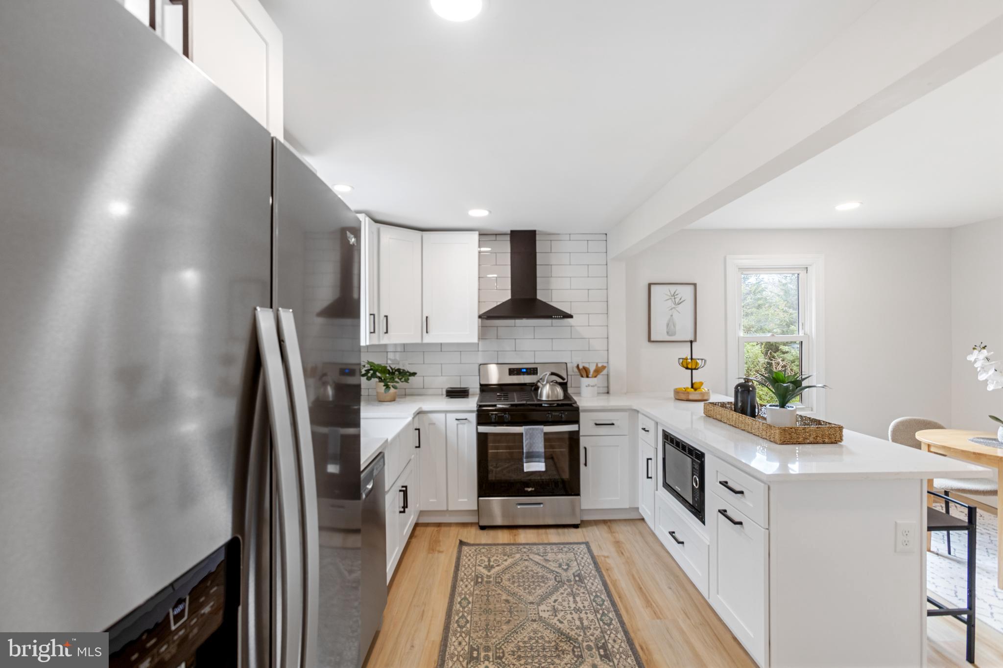766 Highland Road Deptford, NJ 08096 - Photo 18 of 41 a kitchen with stainless steel appliances granite countertop a stove a sink dishwasher and a refrigerator