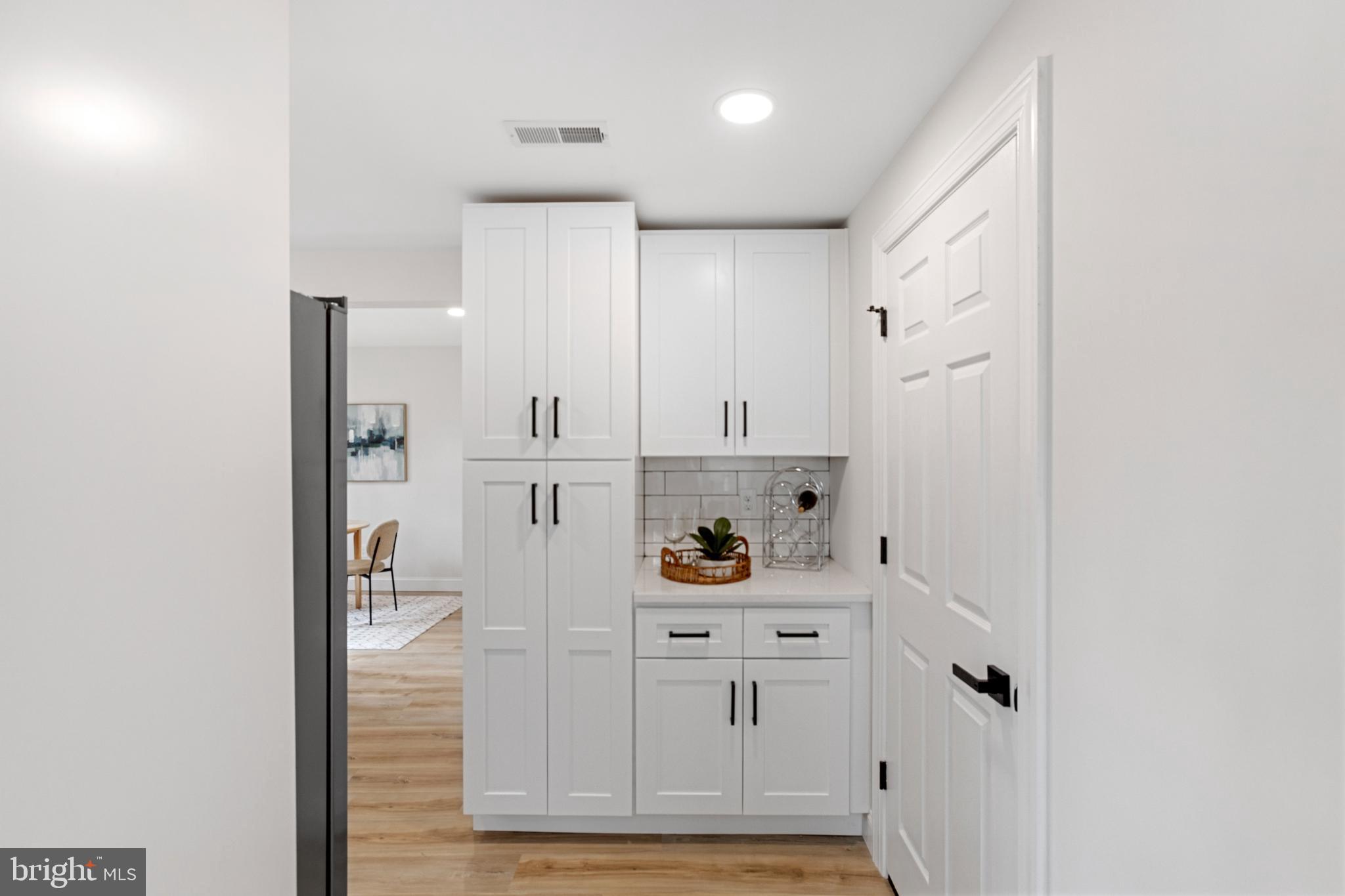 766 Highland Road Deptford, NJ 08096 - Photo 20 of 41 a view of kitchen with refrigerator and white cabinets