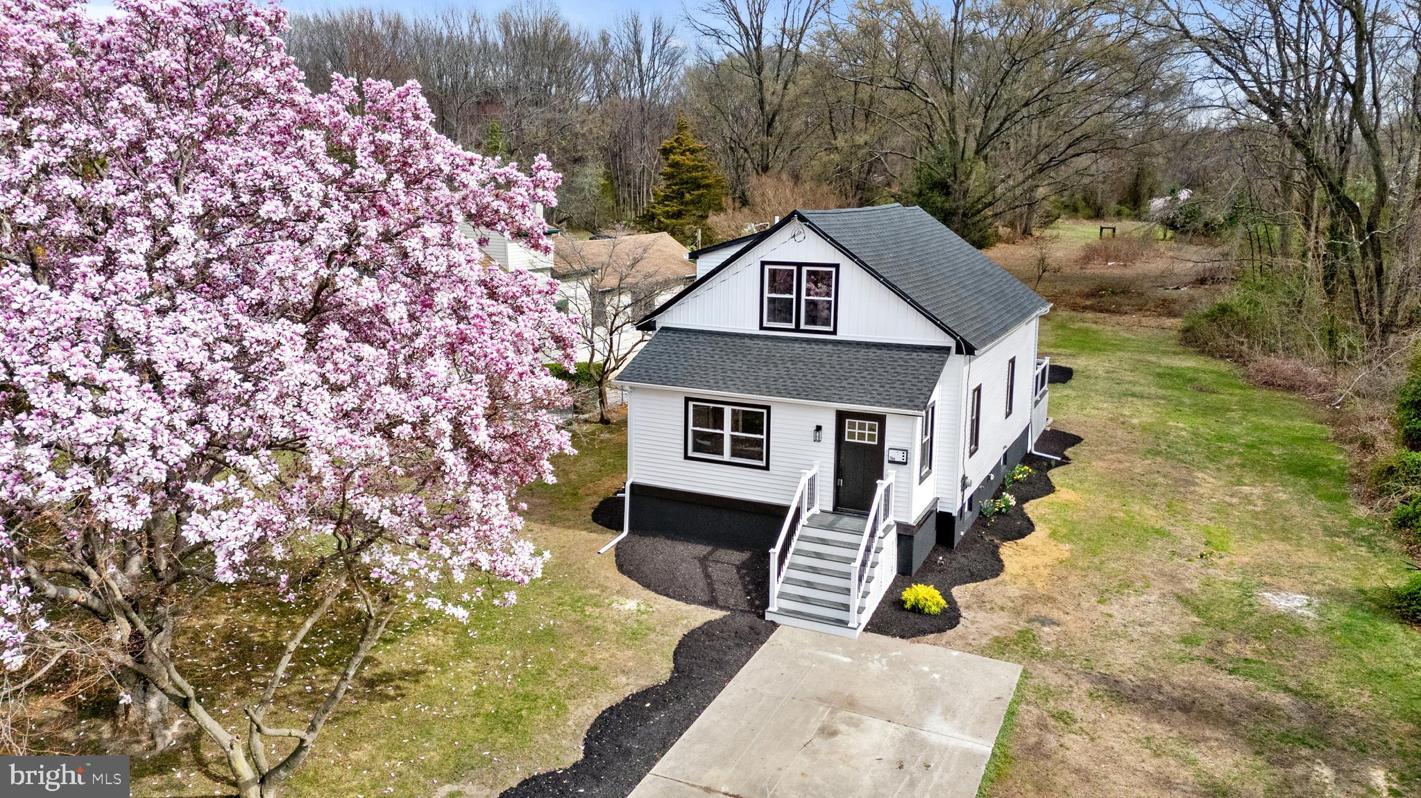 766 Highland Road Deptford, NJ 08096 - Photo 2 of 41 a front view of a house with a garden