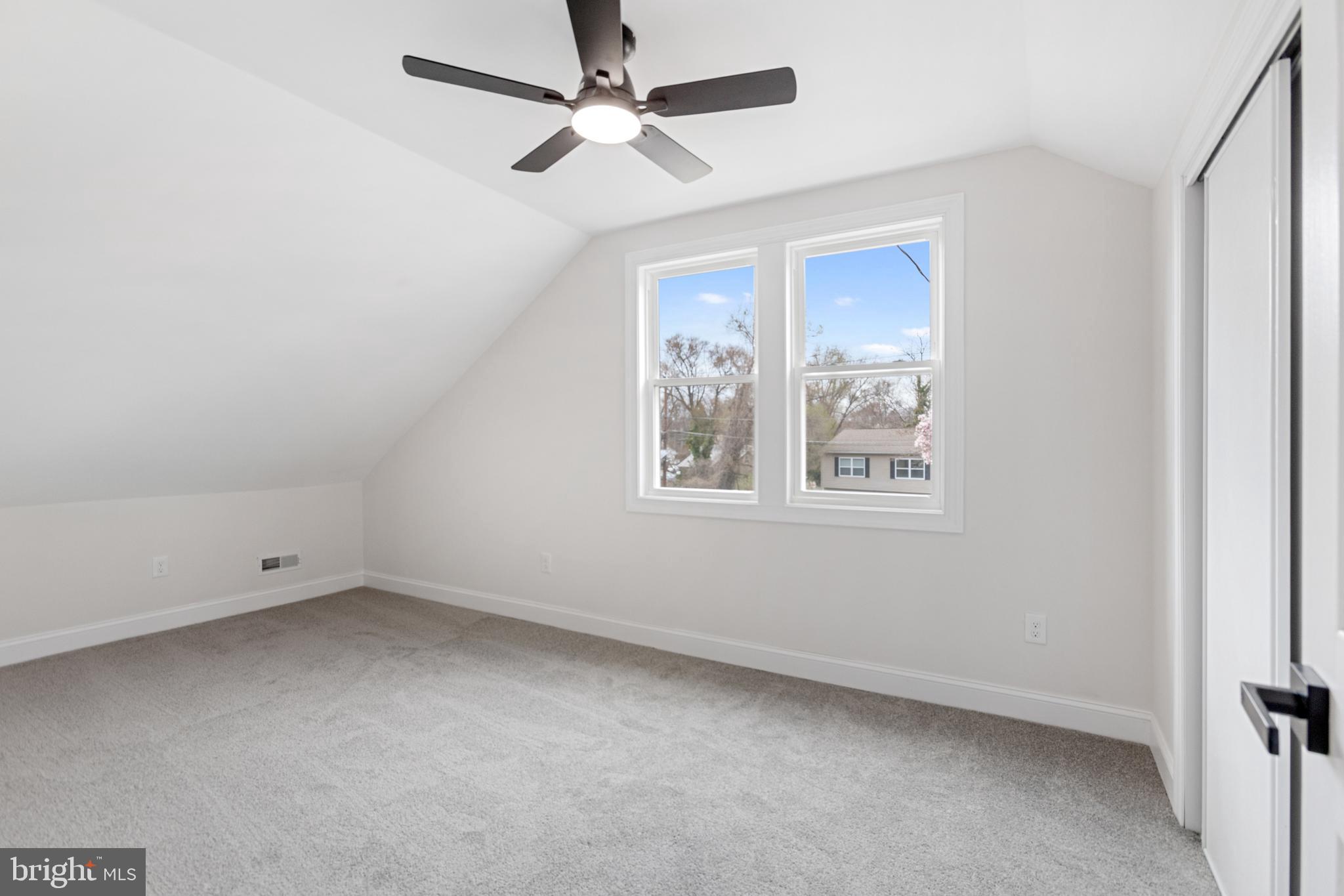 766 Highland Road Deptford, NJ 08096 - Photo 25 of 41 an empty room with a window and a fan