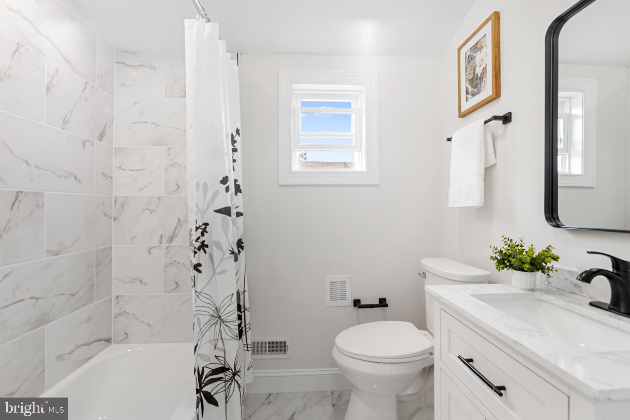 766 Highland Road Deptford, NJ 08096 - Photo 27 of 41 a bathroom with a sink toilet and shower
