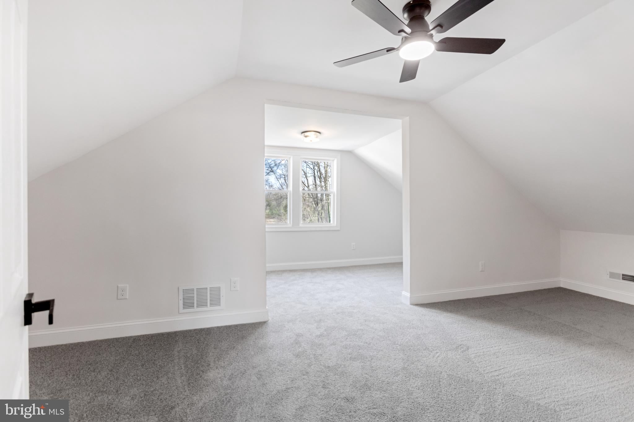766 Highland Road Deptford, NJ 08096 - Photo 29 of 41 an empty room with windows and fan