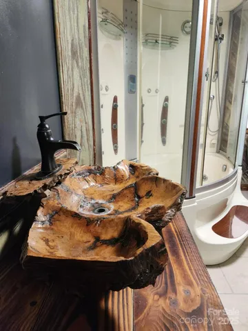 a bedroom with a bed and a mirror