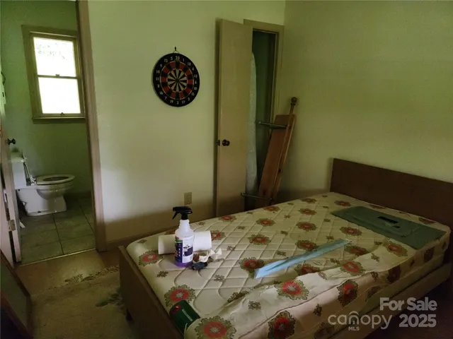 a bedroom with a bed and a table in it