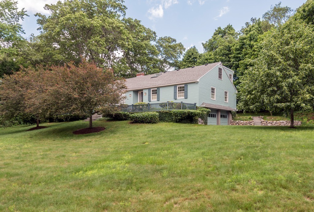 18 Wildwood Road Andover, MA 01810 - Photo 2 of 30 a view of a house with a backyard and a tree