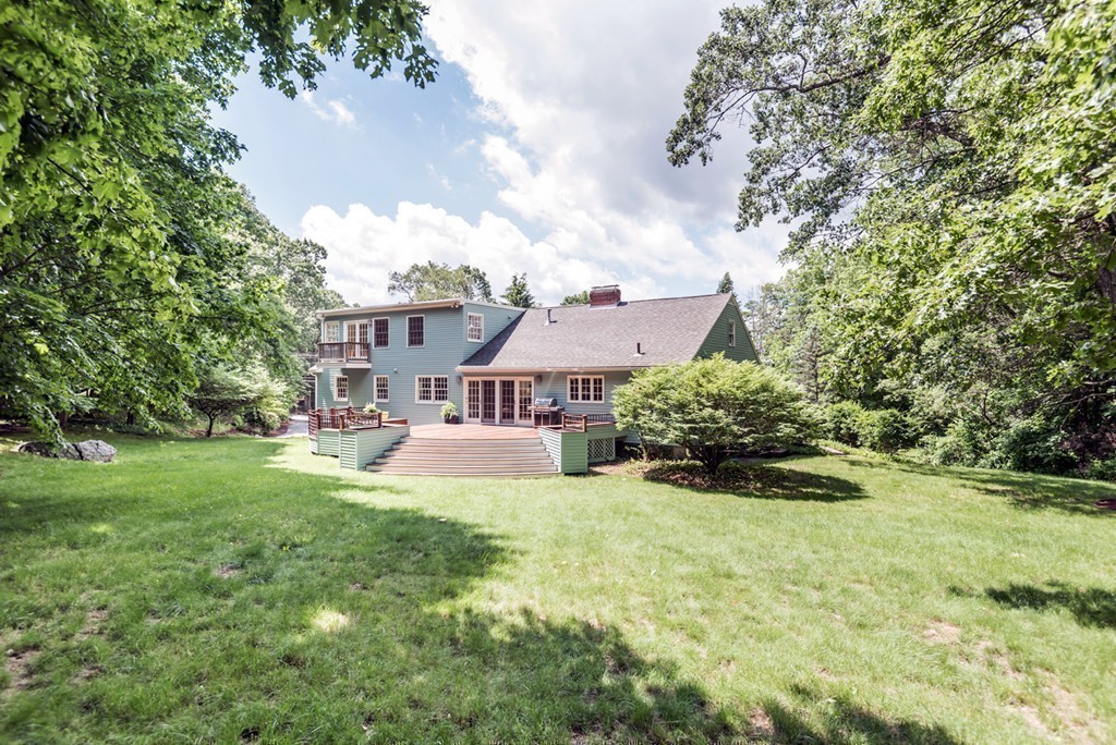 18 Wildwood Road Andover, MA 01810 - Photo 30 of 30 a view of a house with a big yard potted plants and a large tree
