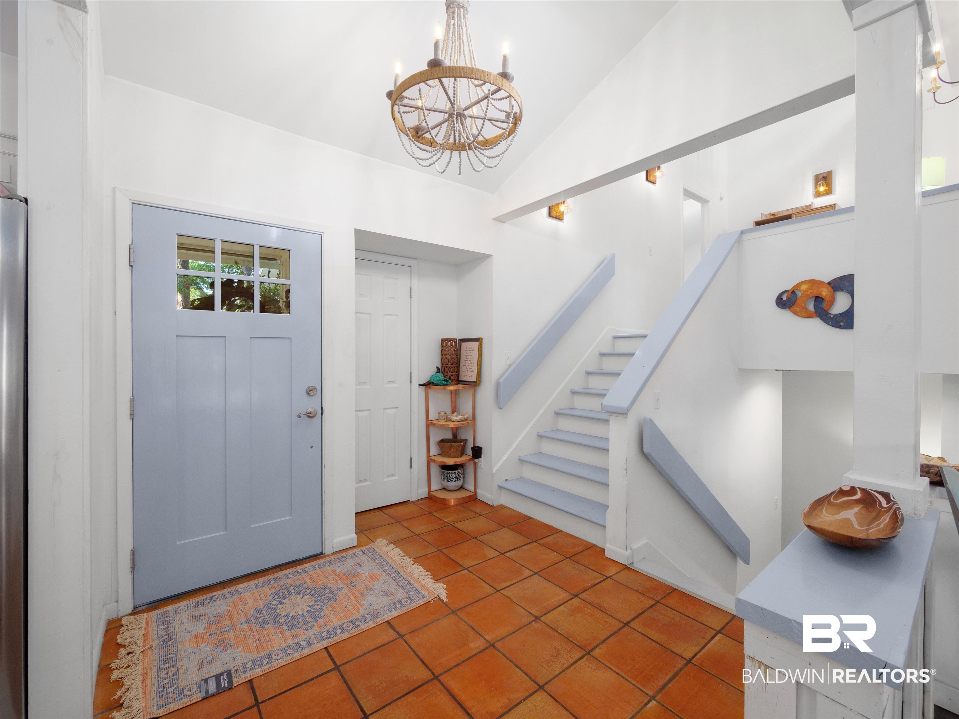 494 Ridgewood Drive Daphne, AL 36526 - Photo 8 of 40 Foyer with a notable chandelier, high vaulted ceiling, and tile patterned flooring