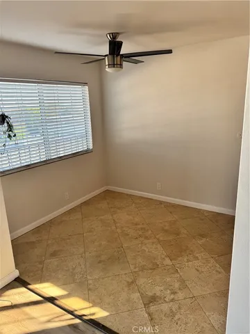 a view of a room with rack on the wall and a window