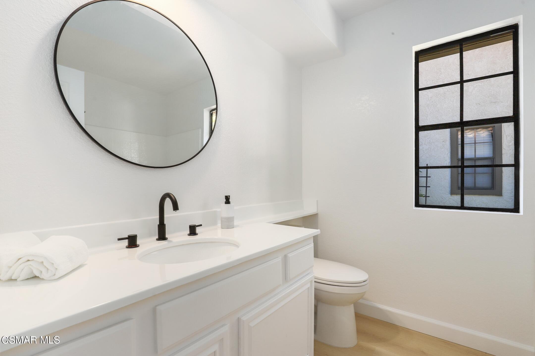 765 Congressional Road Simi Valley, CA 93065 - Photo 28 of 35 a bathroom with a sink and a mirror