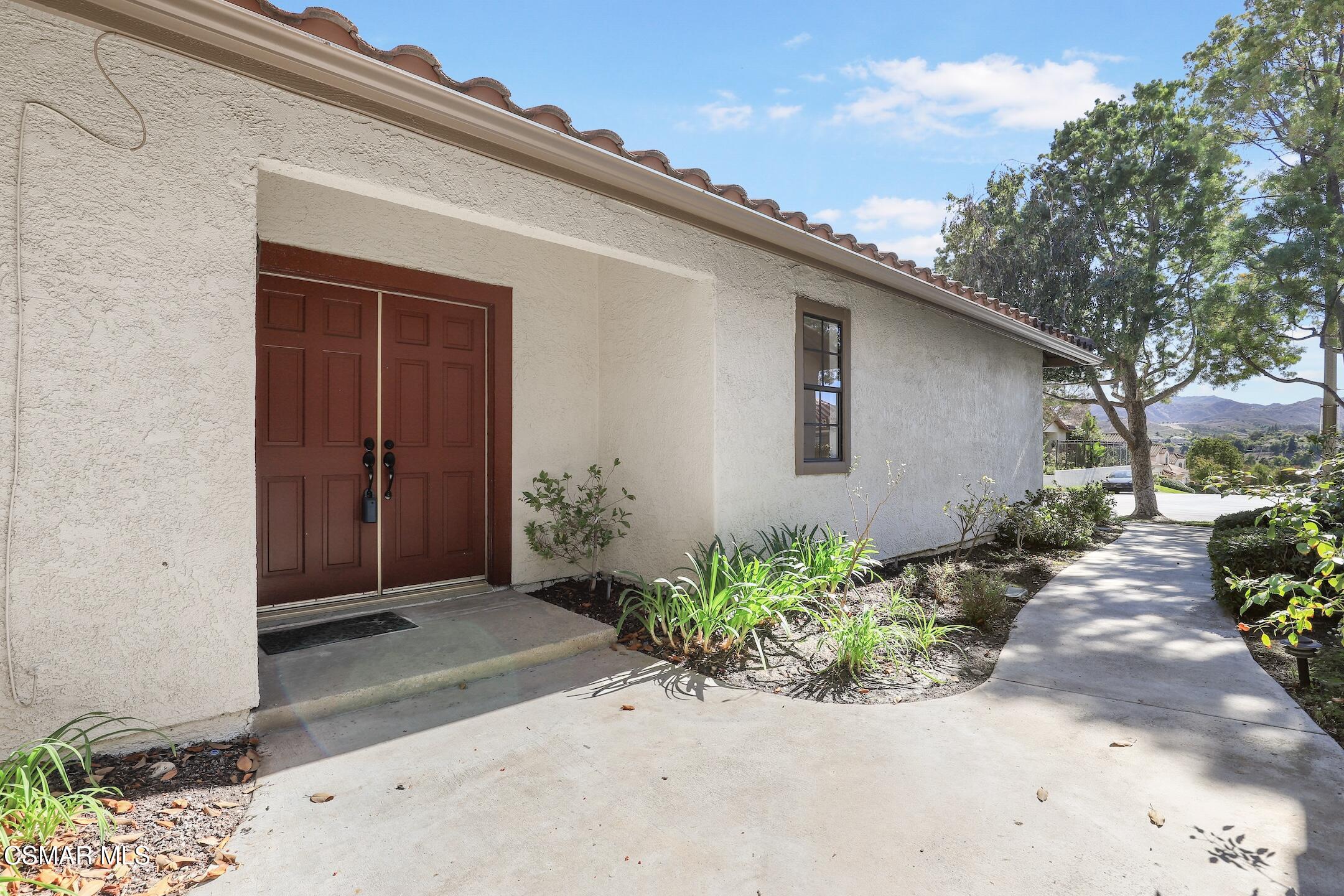 765 Congressional Road Simi Valley, CA 93065 - Photo 3 of 35 a backyard of a house with potted plants and seating space