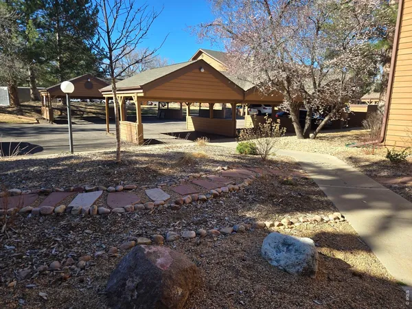 a view of a car park in front of house