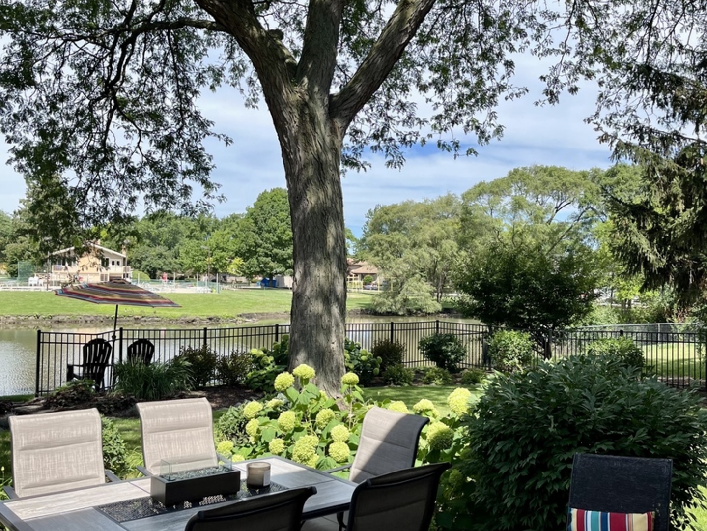 210 North Baynard Road Addison, IL 60101 - Photo 54 of 65 a view of a garden with plants and large trees