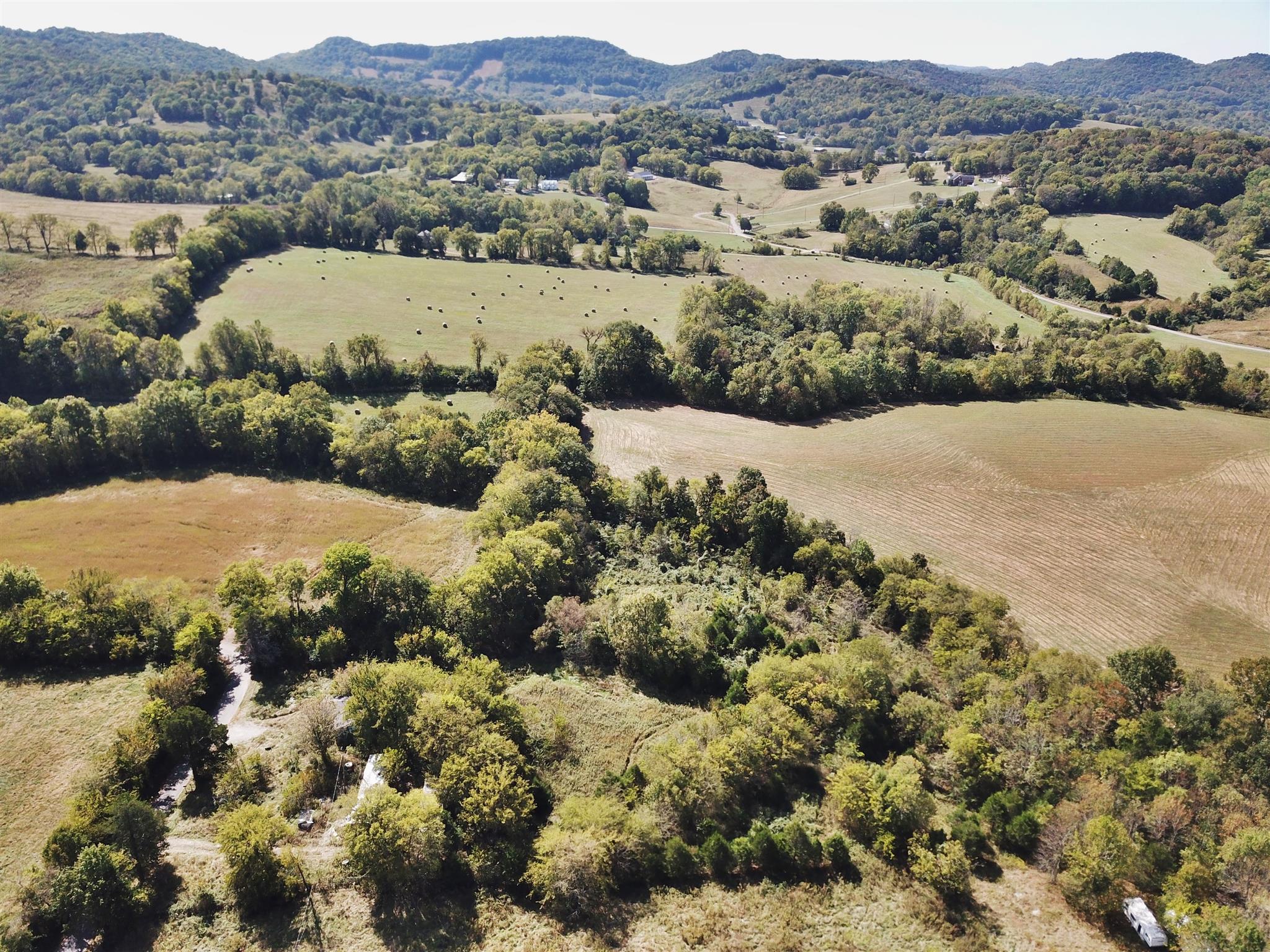 1230 Neal Road Watertown, TN 37184 - Photo 3 of 5 an aerial view of a houses with a lush green hillside