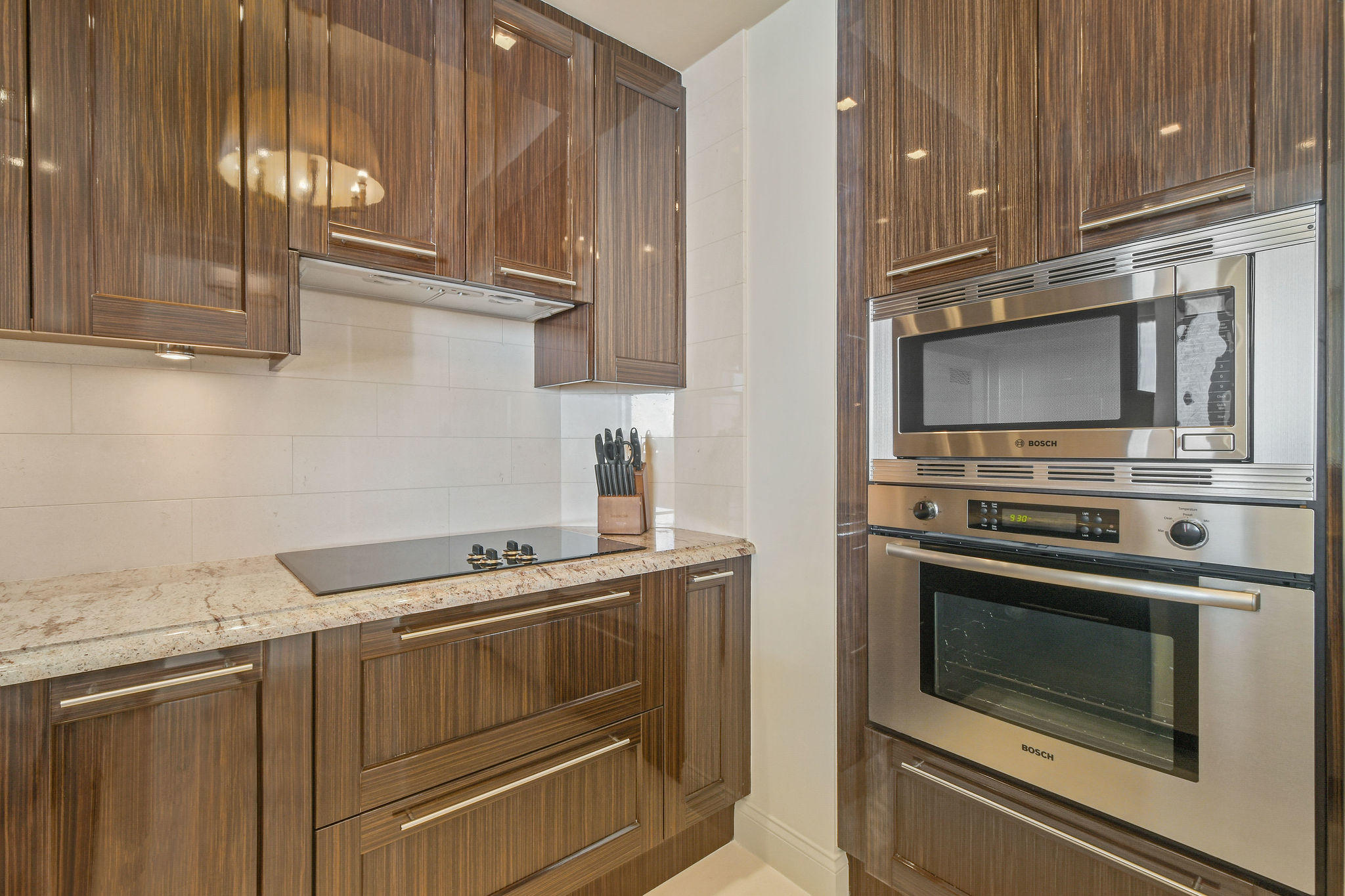 2700 North Ocean Drive, Unit LPH4B Riviera Beach, FL 33404 - Photo 14 of 67 a kitchen with granite countertop a stove and a sink