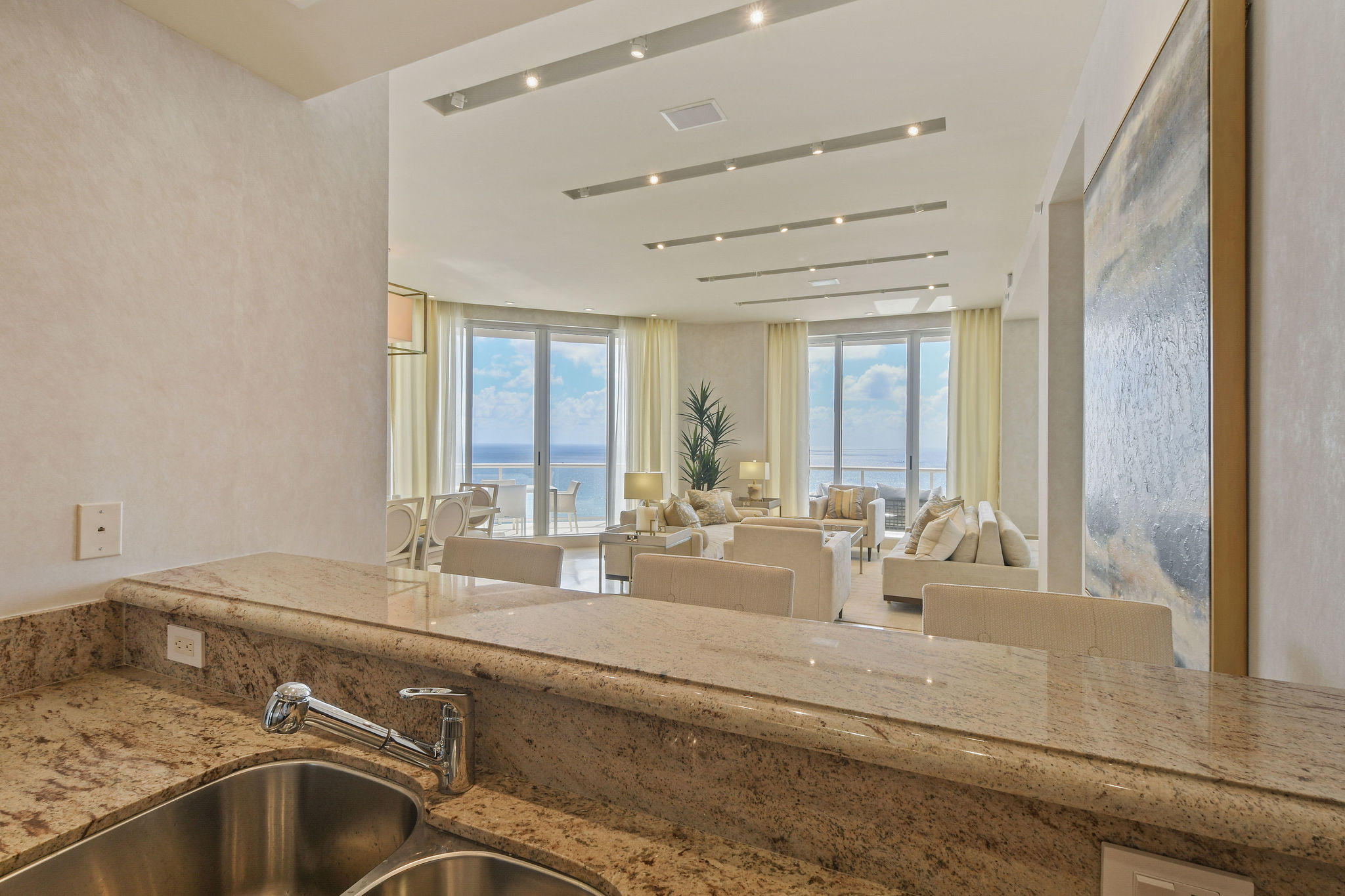 2700 North Ocean Drive, Unit LPH4B Riviera Beach, FL 33404 - Photo 15 of 67 a view of a kitchen with granite countertop a sink and cabinets