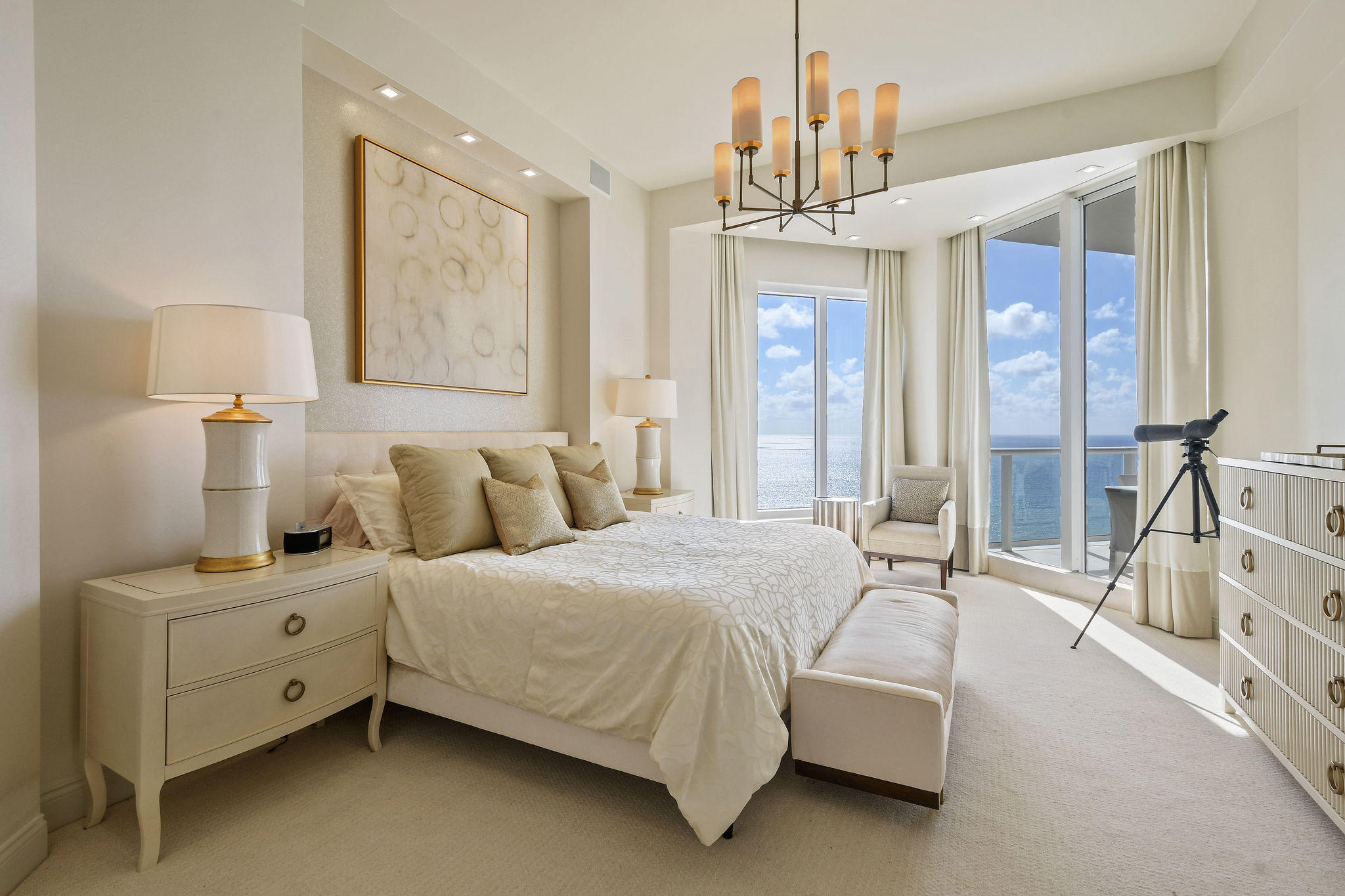 2700 North Ocean Drive, Unit LPH4B Riviera Beach, FL 33404 - Photo 16 of 67 a bed room with a bed and a chandelier