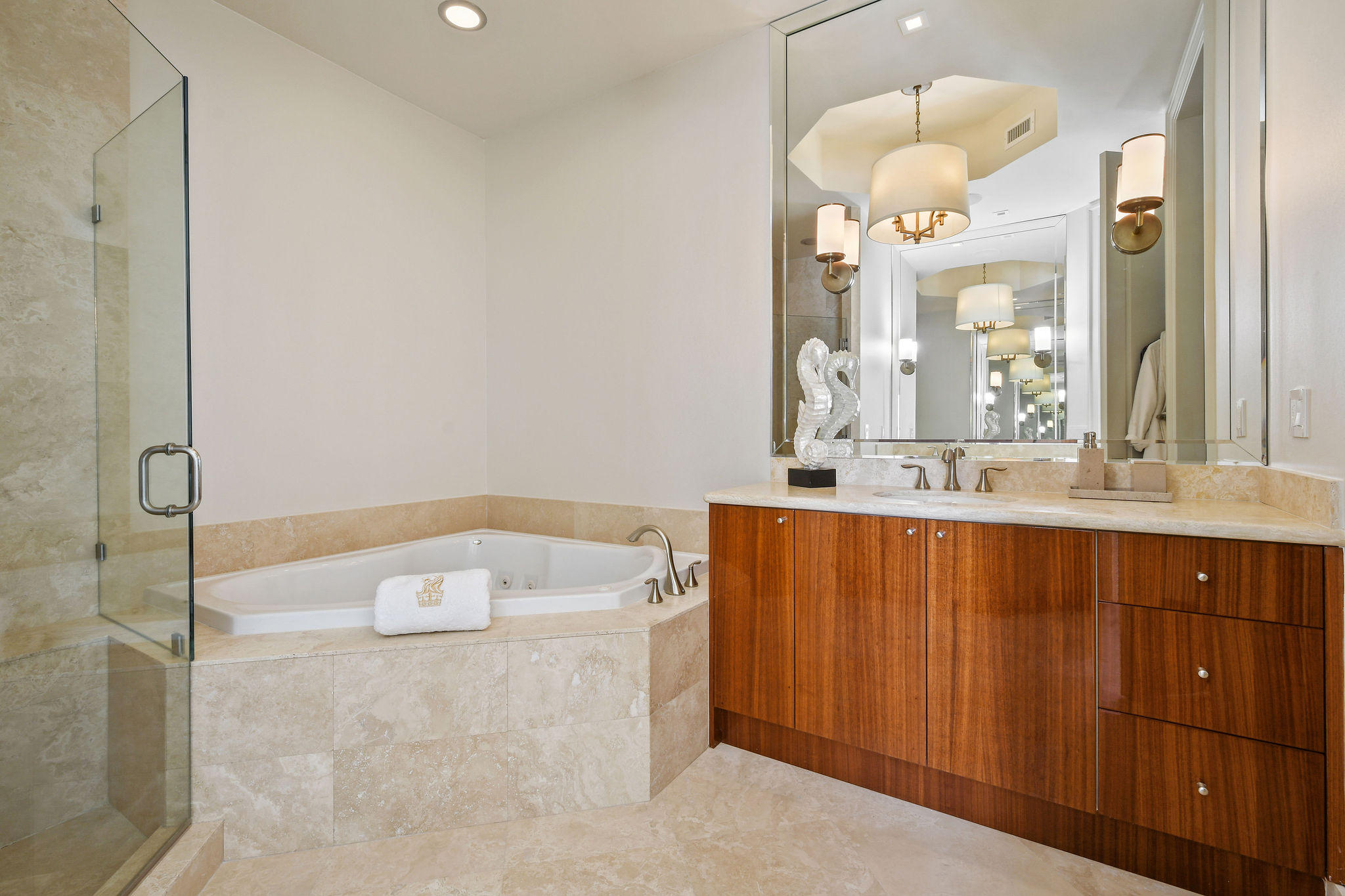2700 North Ocean Drive, Unit LPH4B Riviera Beach, FL 33404 - Photo 19 of 67 a bathroom with a sink a large mirror and a shower
