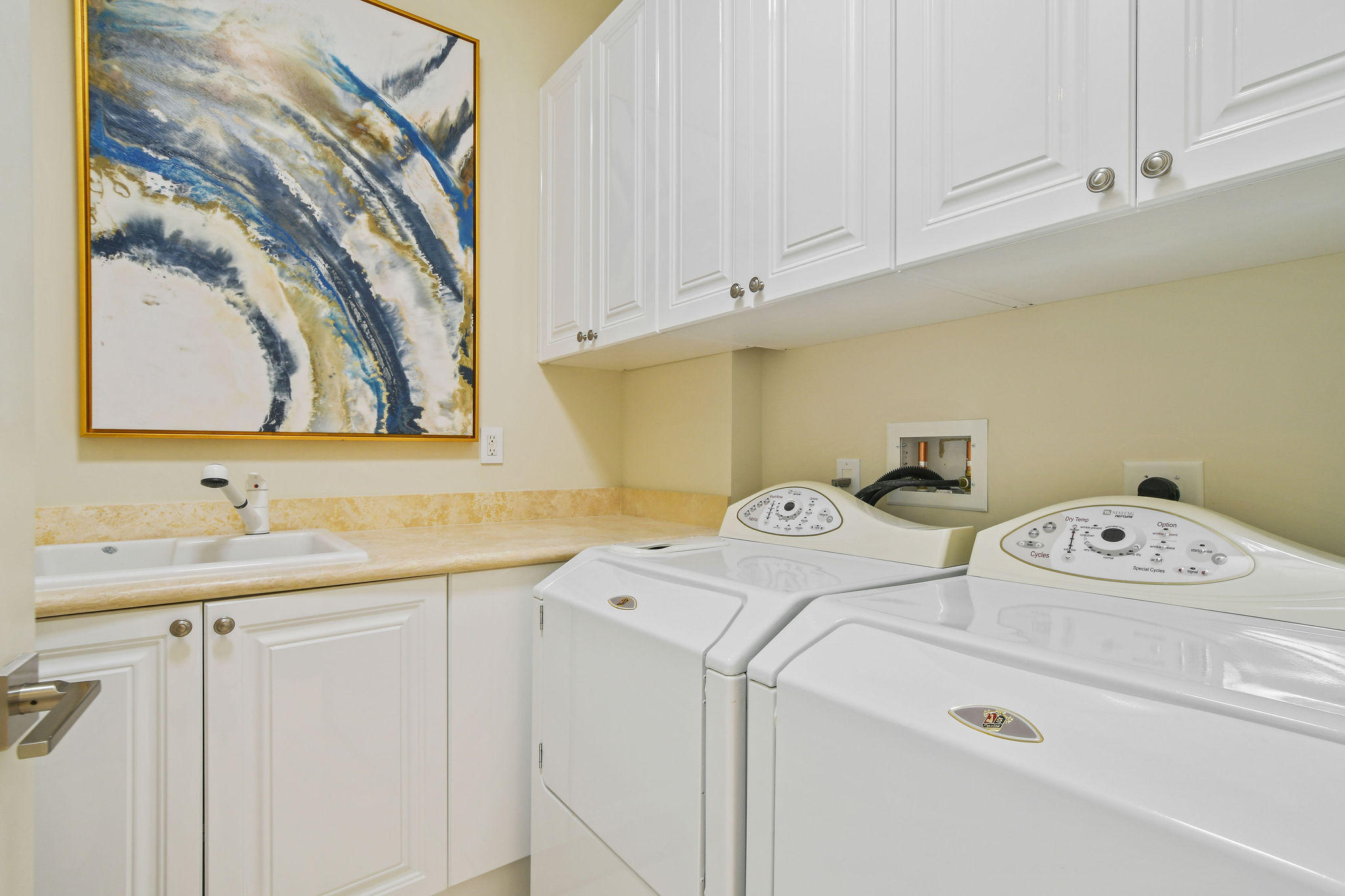 2700 North Ocean Drive, Unit LPH4B Riviera Beach, FL 33404 - Photo 28 of 67 a utility room with dryer and washer