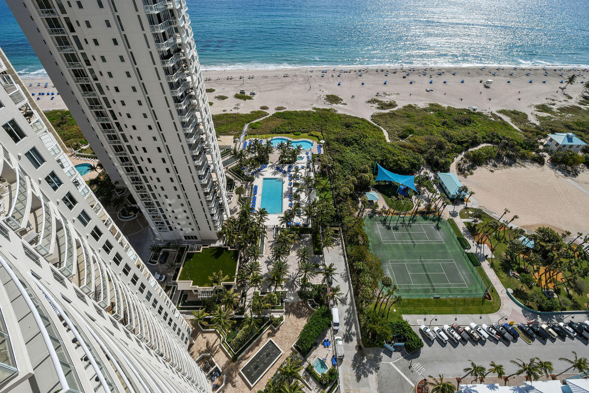 2700 North Ocean Drive, Unit LPH4B Riviera Beach, FL 33404 - Photo 32 of 67 a view of a swimming pool with a yard