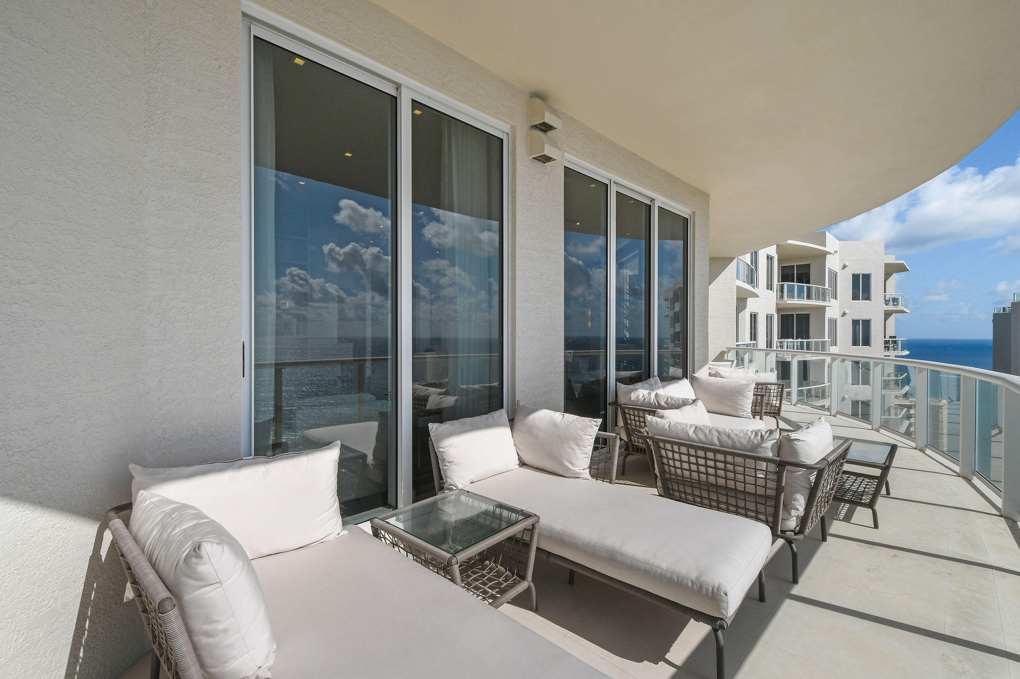 2700 North Ocean Drive, Unit LPH4B Riviera Beach, FL 33404 - Photo 43 of 67 a living room with furniture and a floor to ceiling window