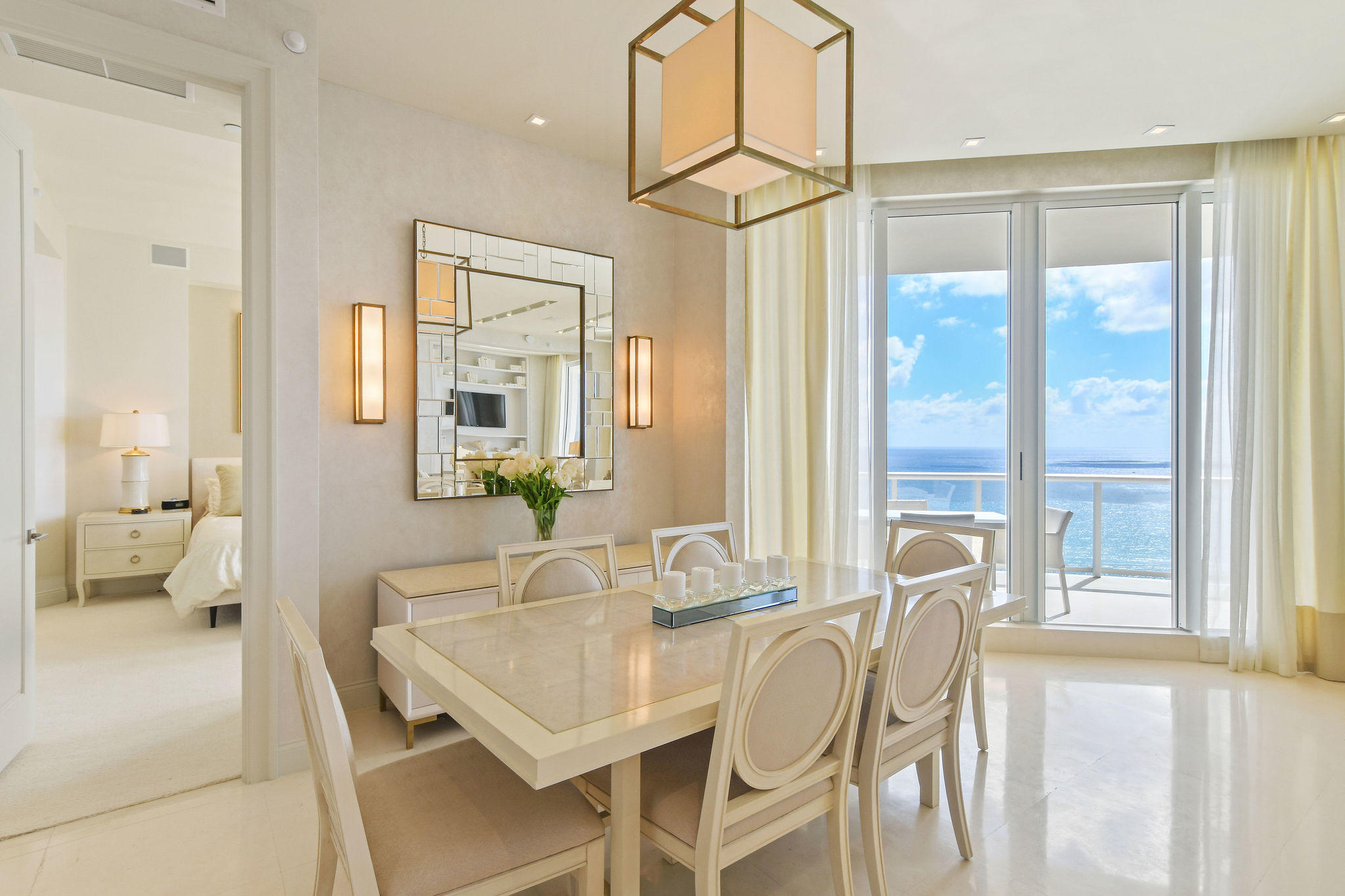 2700 North Ocean Drive, Unit LPH4B Riviera Beach, FL 33404 - Photo 9 of 67 a view of a dining room with furniture window and wooden floor