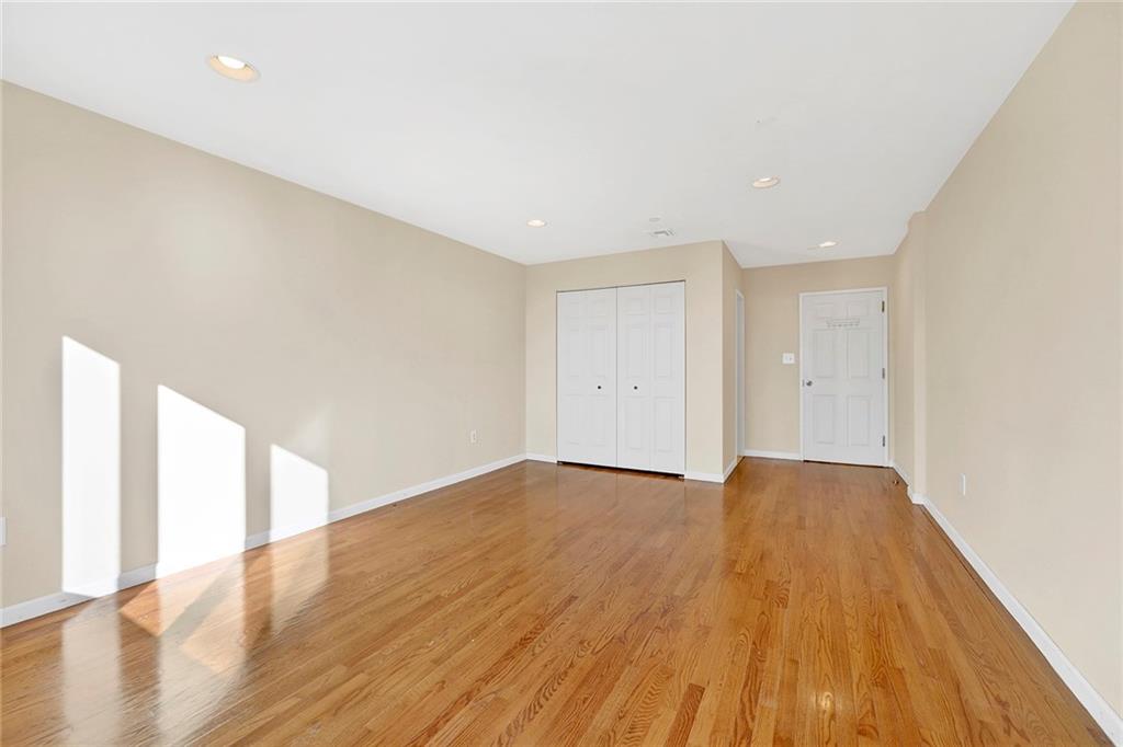 52 92nd Street, Unit 7C Brooklyn, NY 11209 - Photo 14 of 22 a view of an empty room with wooden floor