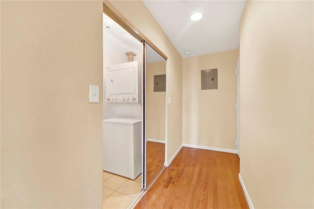 52 92nd Street, Unit 7C Brooklyn, NY 11209 - Photo 21 of 22 a view of a hallway with wooden floor and staircase