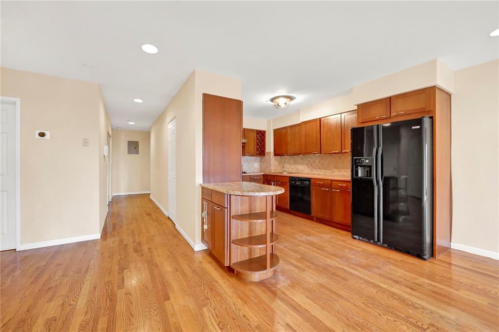 52 92nd Street, Unit 7C Brooklyn, NY 11209 - Photo 5 of 22 a kitchen with a refrigerator and a sink