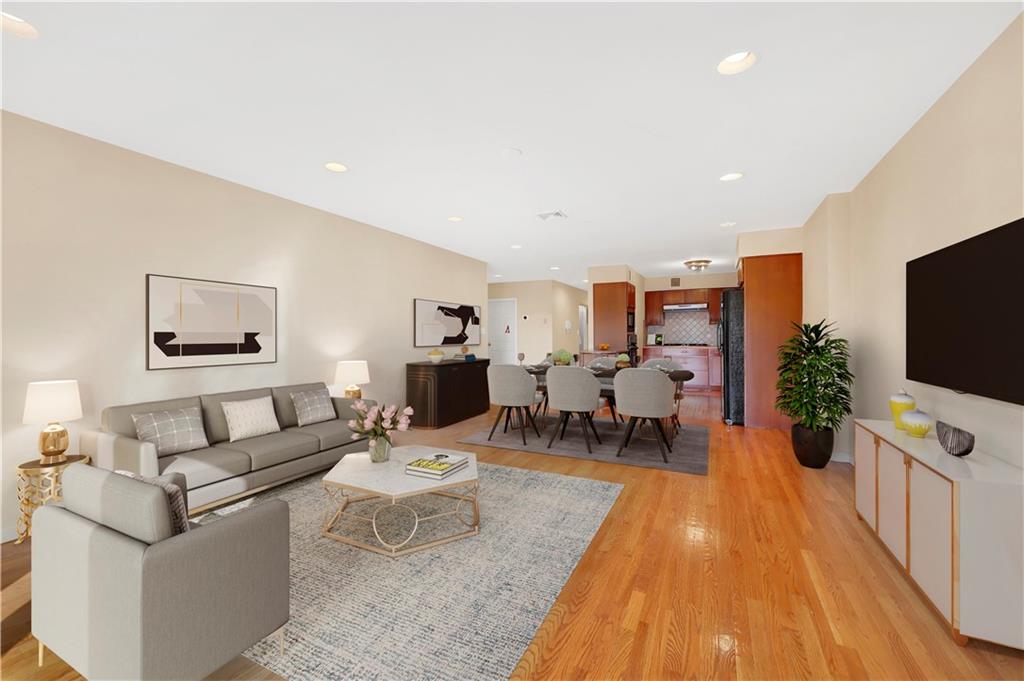 52 92nd Street, Unit 7C Brooklyn, NY 11209 - Photo 7 of 22 a living room with furniture and a flat screen tv